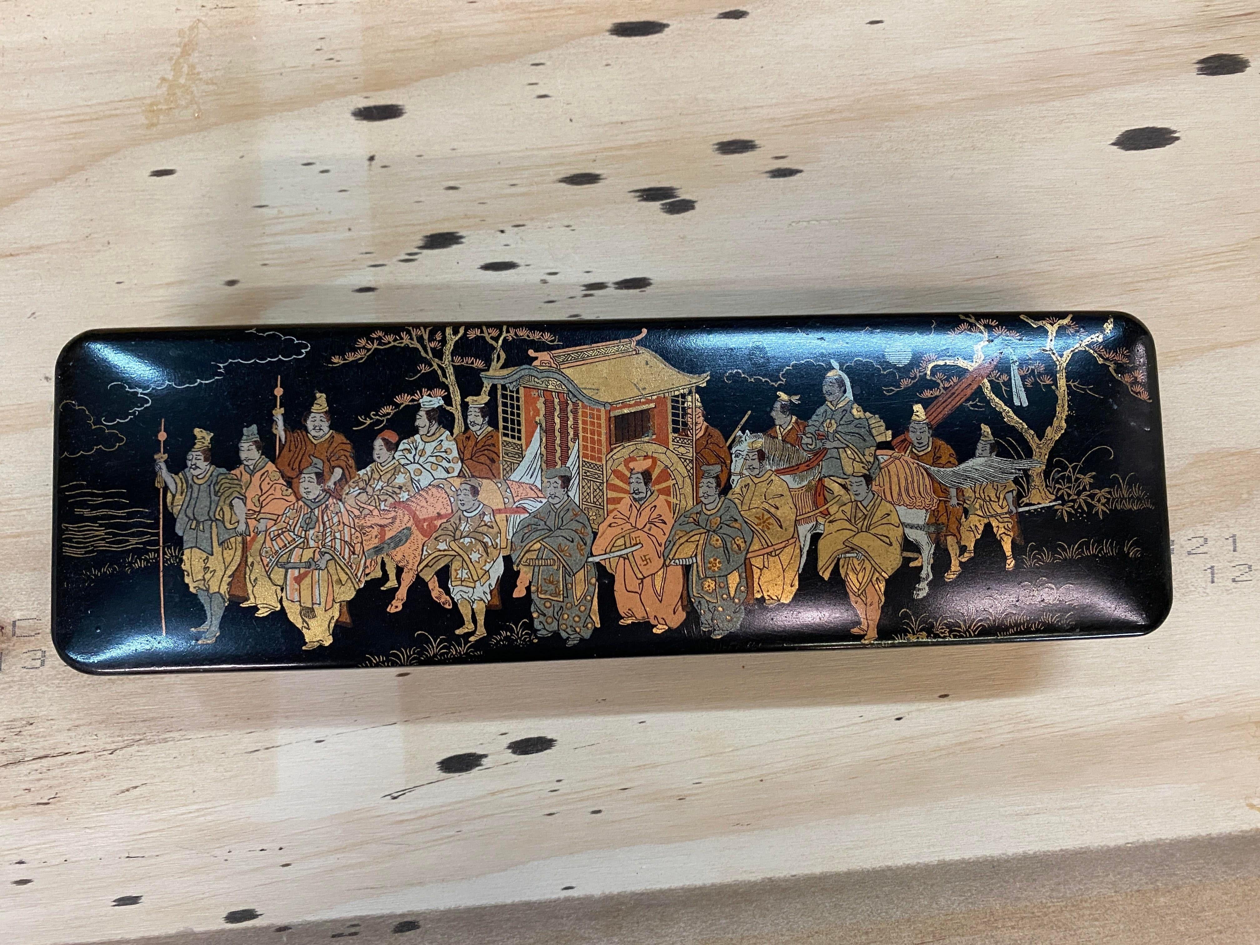 Black, Gold and Red Lacquer Japanese Document Fubako Box, Meiji period, late 19th C/Early 20th C. A Japanese lacquer box featuring hand decorated gold paint depicting scholars and samurai walking in a royal procession.

Acquired from an antique