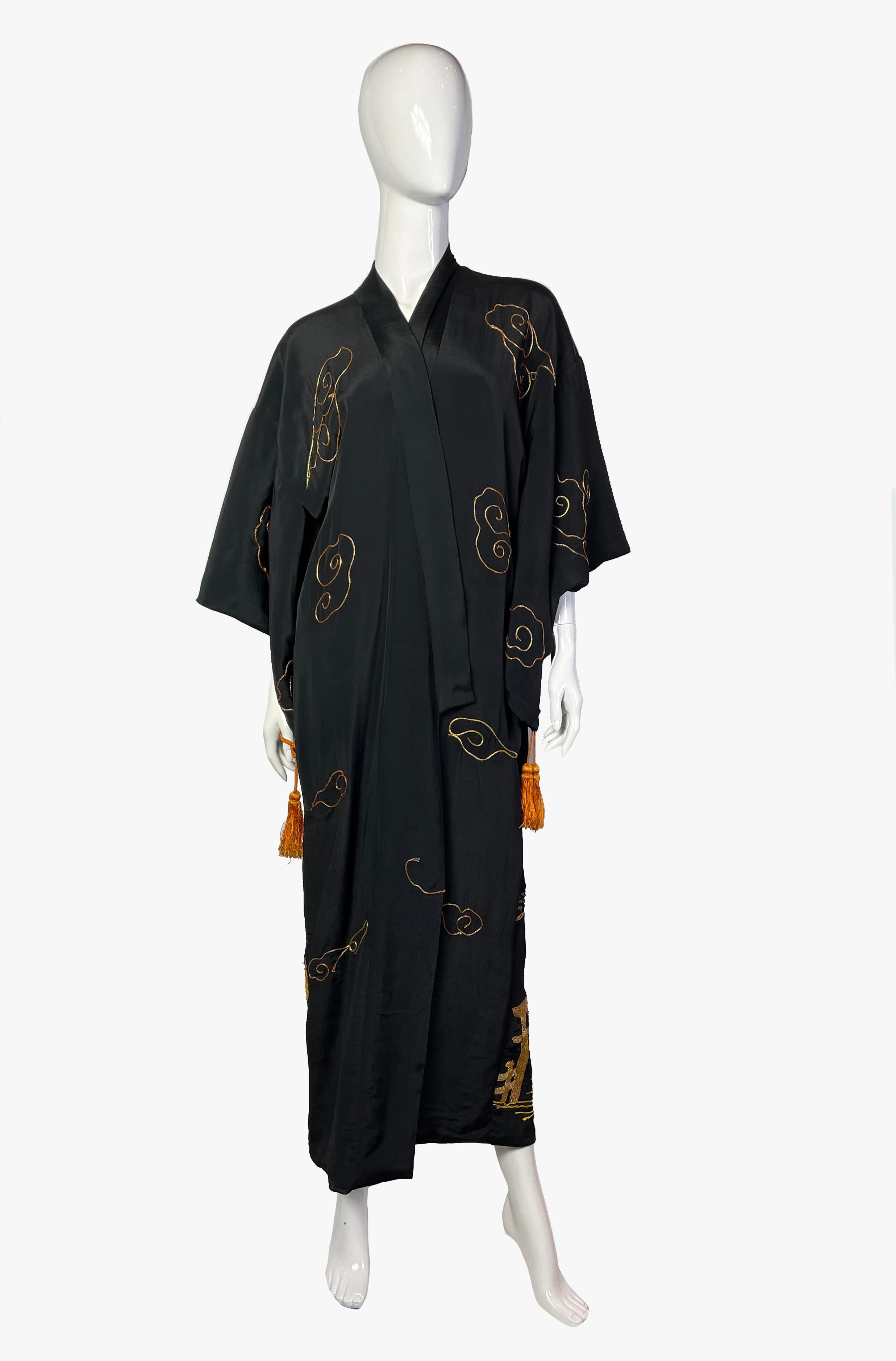 Vintage black silk kimono hand-embroidered with traditional Japanese motives.
Embroidery includes golden clouds in the front, massive embroidery of a dragon, mountains and a traditional Japanese house on the back. 

Composition: 100%