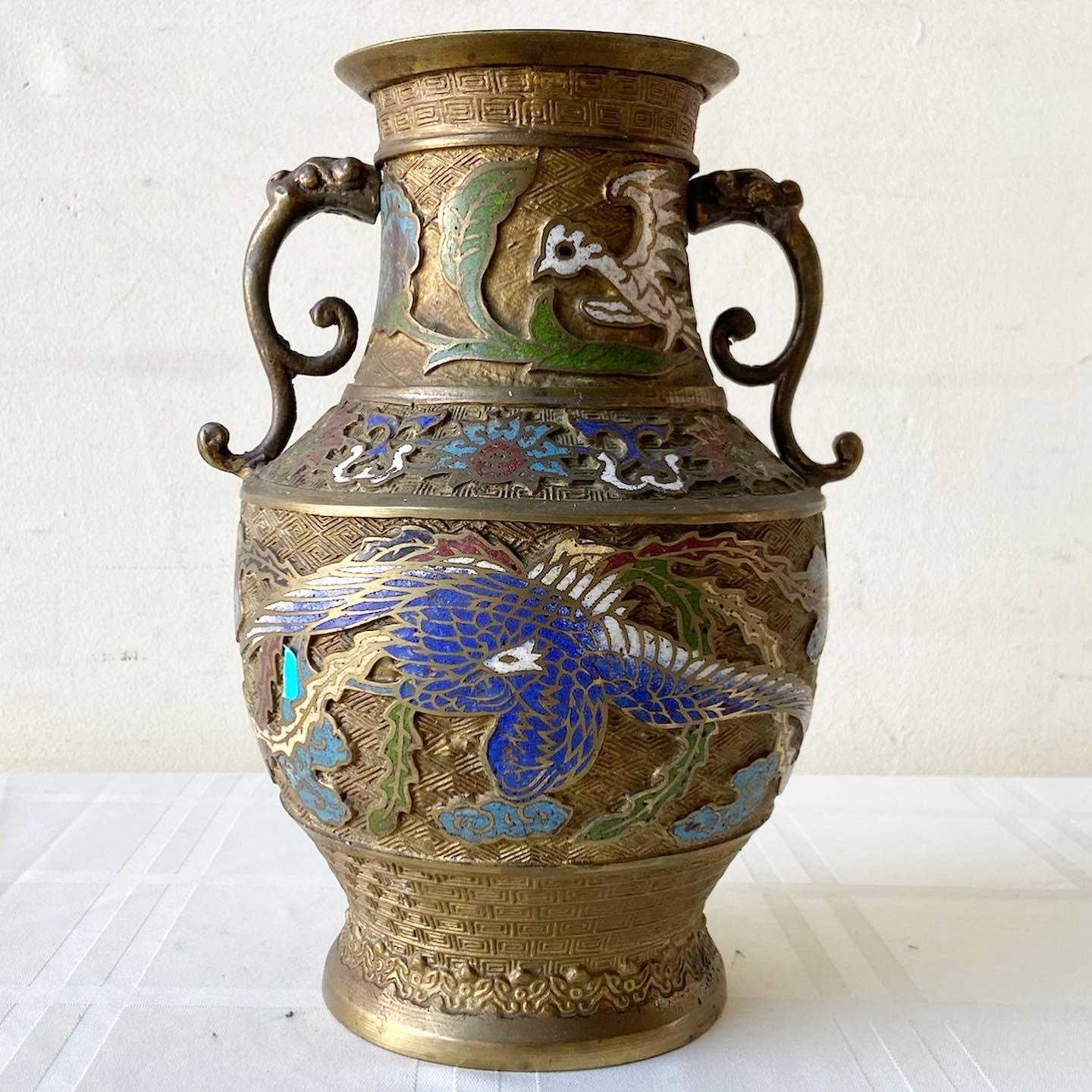 Stunning early 20th century Japanese brass champleve vase. Features a vibrant enamel design throughout the vase.
 