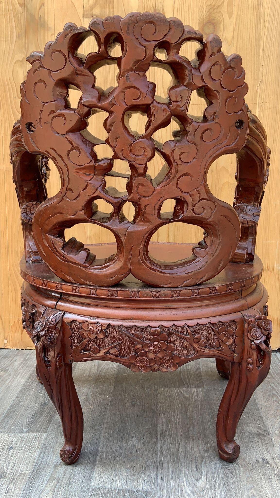Vintage Japanese Carved Floral Accent Chair

This Vintage Japanese Carved Floral Accent Chair is a stunning piece of furniture!
	1.	Carved Wood: The chair is intricately hand-carved from wood, showcasing exquisite craftsmanship. The carving often