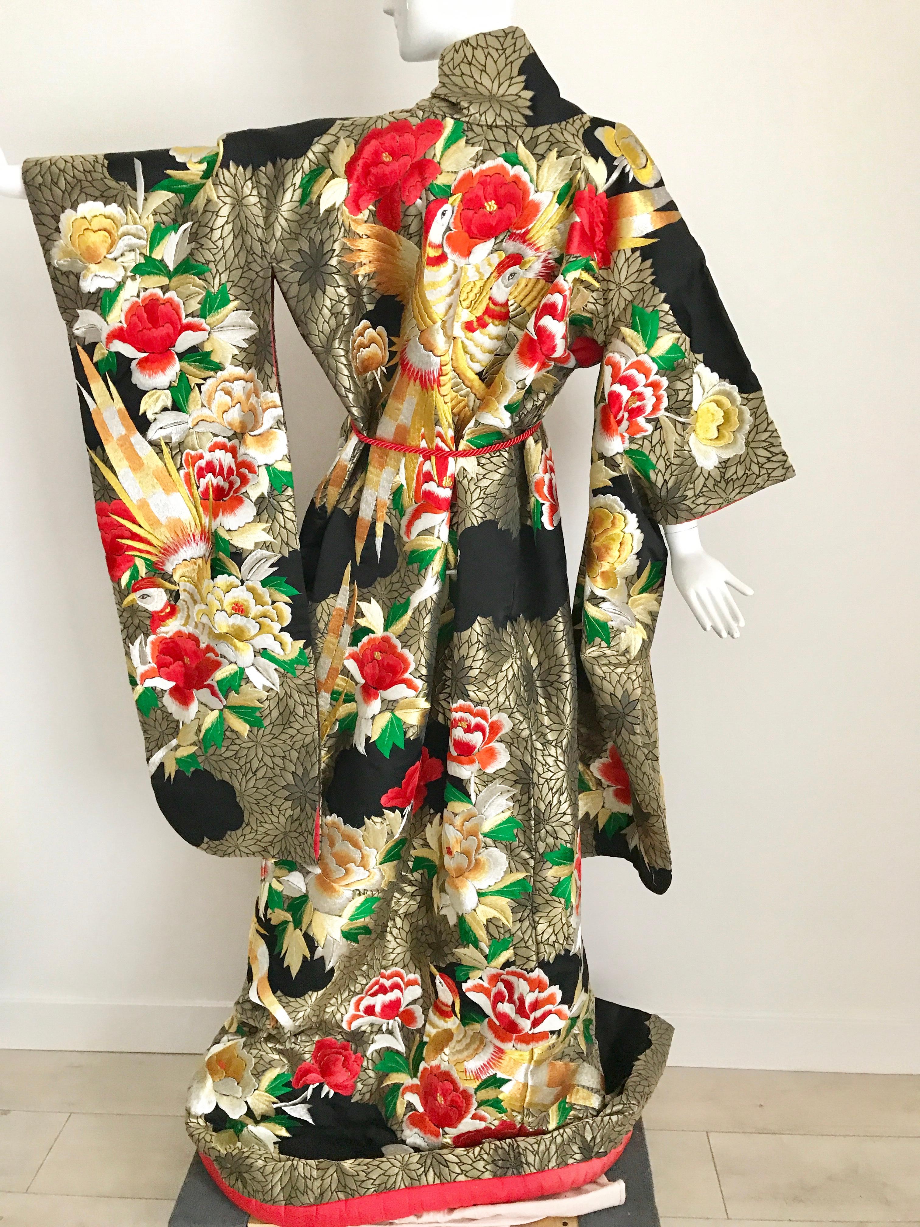 Beautiful vintage Japanese ceremonial brocade kimono embroidered with red and gold floral and Phoenix embroidery. Kimono comes with red rope belt.
Kimono length: 74” length
Note about the flaws: 
The entirety of the external fabric is flawless,