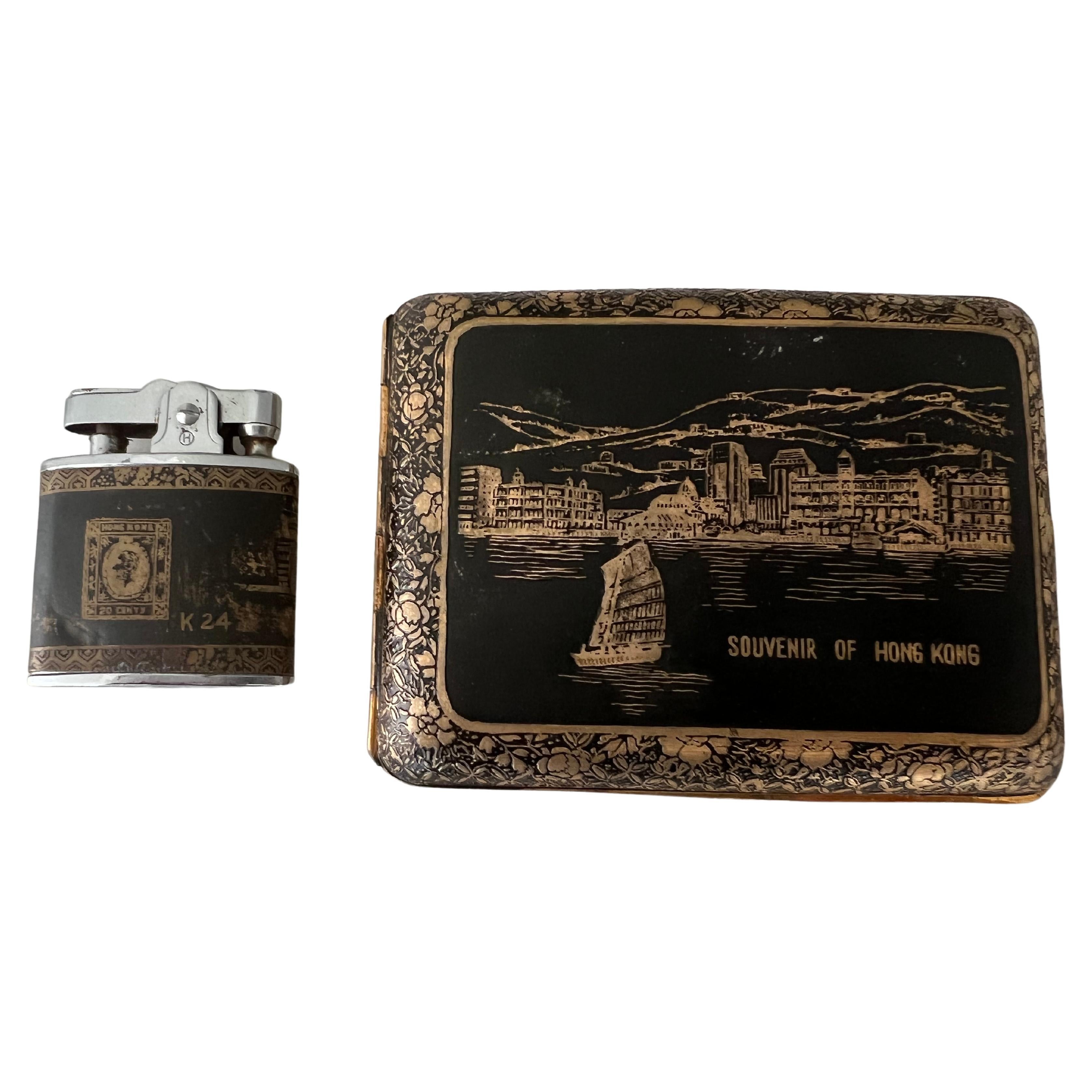 A piece of fun and chic history - Vintage Japanese golden KOMAI  SOUVENIR of HONG KONG cigarette CASE+LIGHTER set in mint condition. 
Japanese Komai Style Cigarette Case & Lighter Set Meiji Period
This antique Japanese cigarette case is signed by an