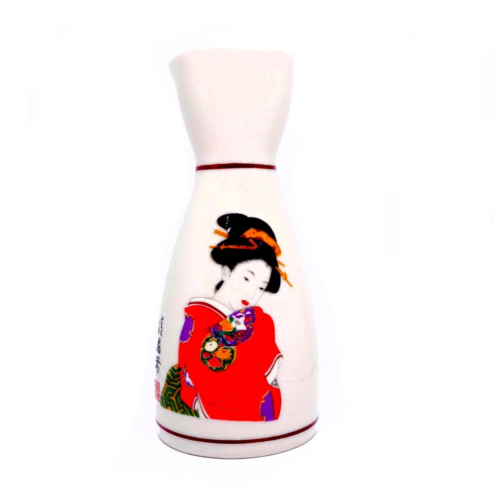 Vintage Hand Painted Ceramics Sake Set Geisha New in Box

Details:
Vintage Unused Sake Set
Made in Japan
New in Opened Box

Includes 2 Decanters and 5 Cups 