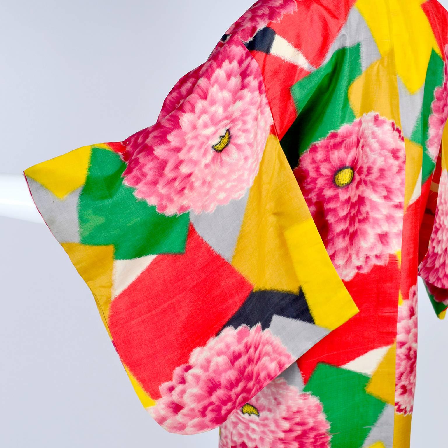 This is a rare 1930's bold printed silk Japanese Haori style jacket in a unusual print with giant zinnias on geometric squares.  The kimono jacket has an inside tie at the center front for closure and can be worn open or closed.  This amazing piece