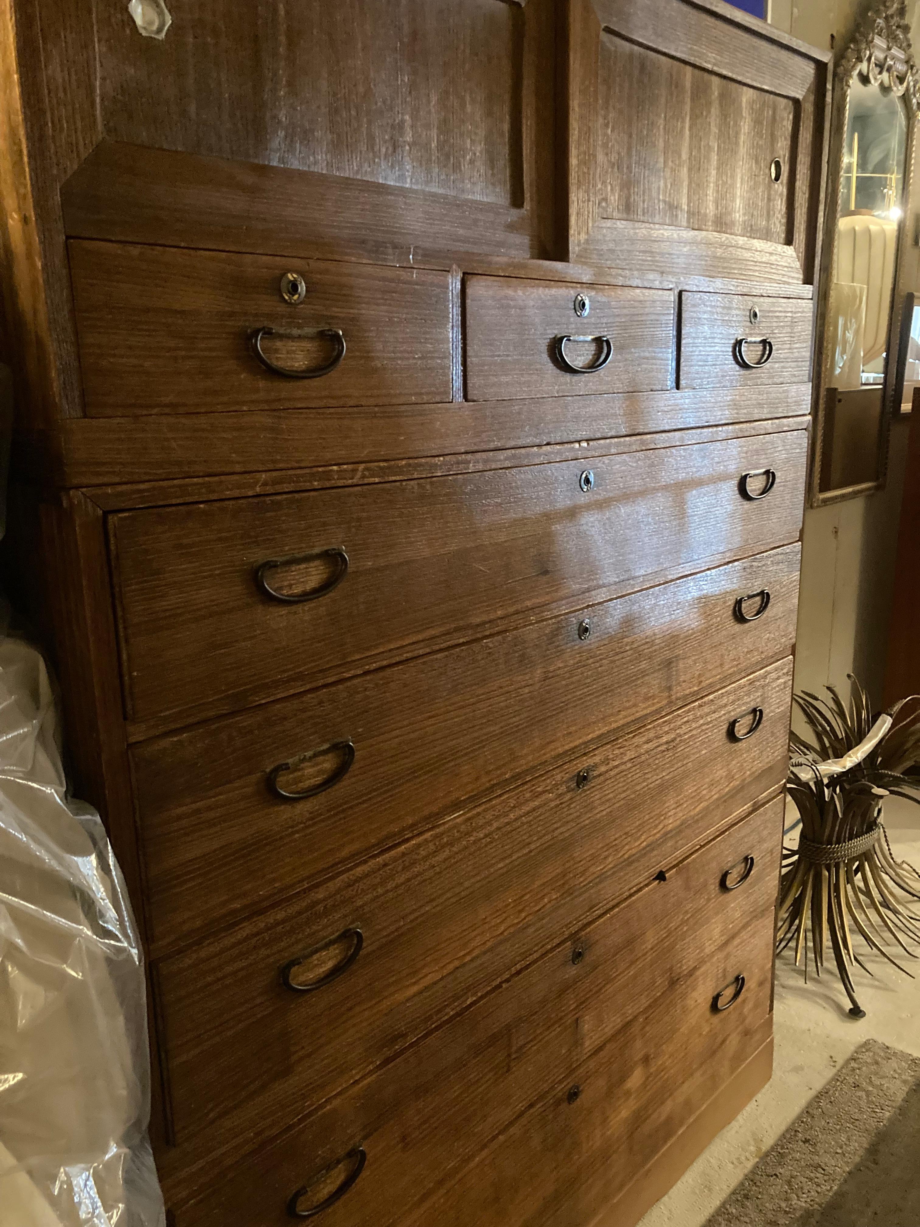Versatile and elegant Japanese Kiriwood Isho Tansu chest. 

The ingenuity of Japanese joinery, usually made without nails or screws. These chest would be used to keep personal treasures, food, and or clothing. Each piece is stacked to create a