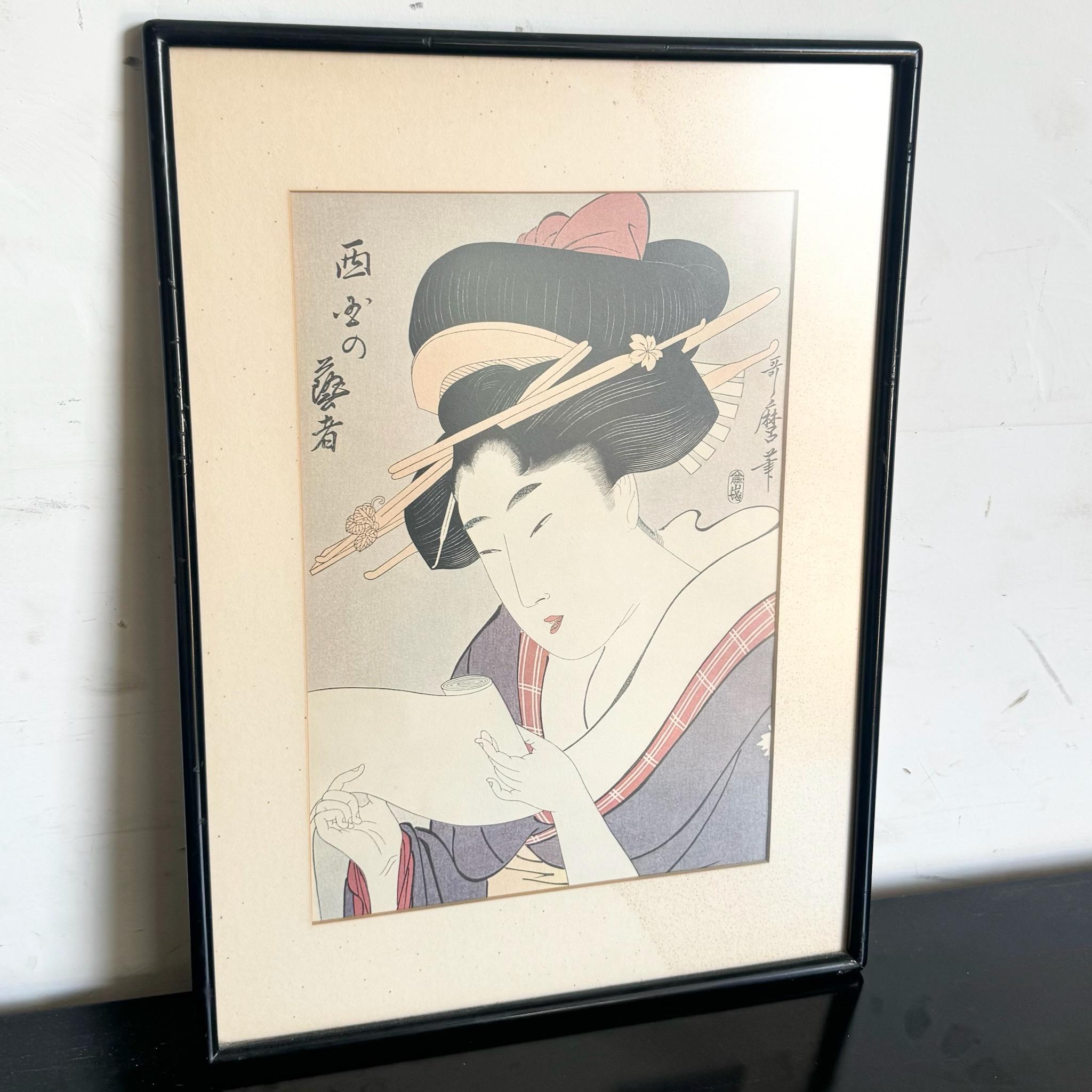Elevate your art collection with this vintage Japanese print by Kitagawa Utamaro, renowned for his portraits of beautiful women. This piece captures the delicate beauty and elegance of traditional Japanese art, making it a perfect addition to any