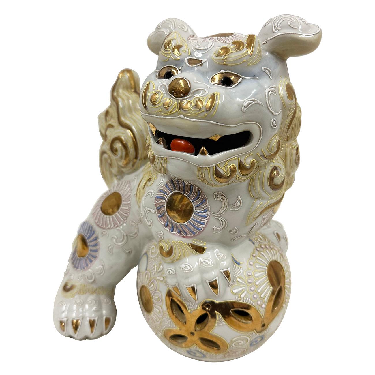 This fine Vintage Japanese Ceramic/Porcelain Lion/Foo Dog Statuary was hand crafted by Kutani in Japan. It has beautiful color glaze with gilt and detailed carving works shows this happy foo dog is playing with ball. It also called Shi Shi Foo Dog