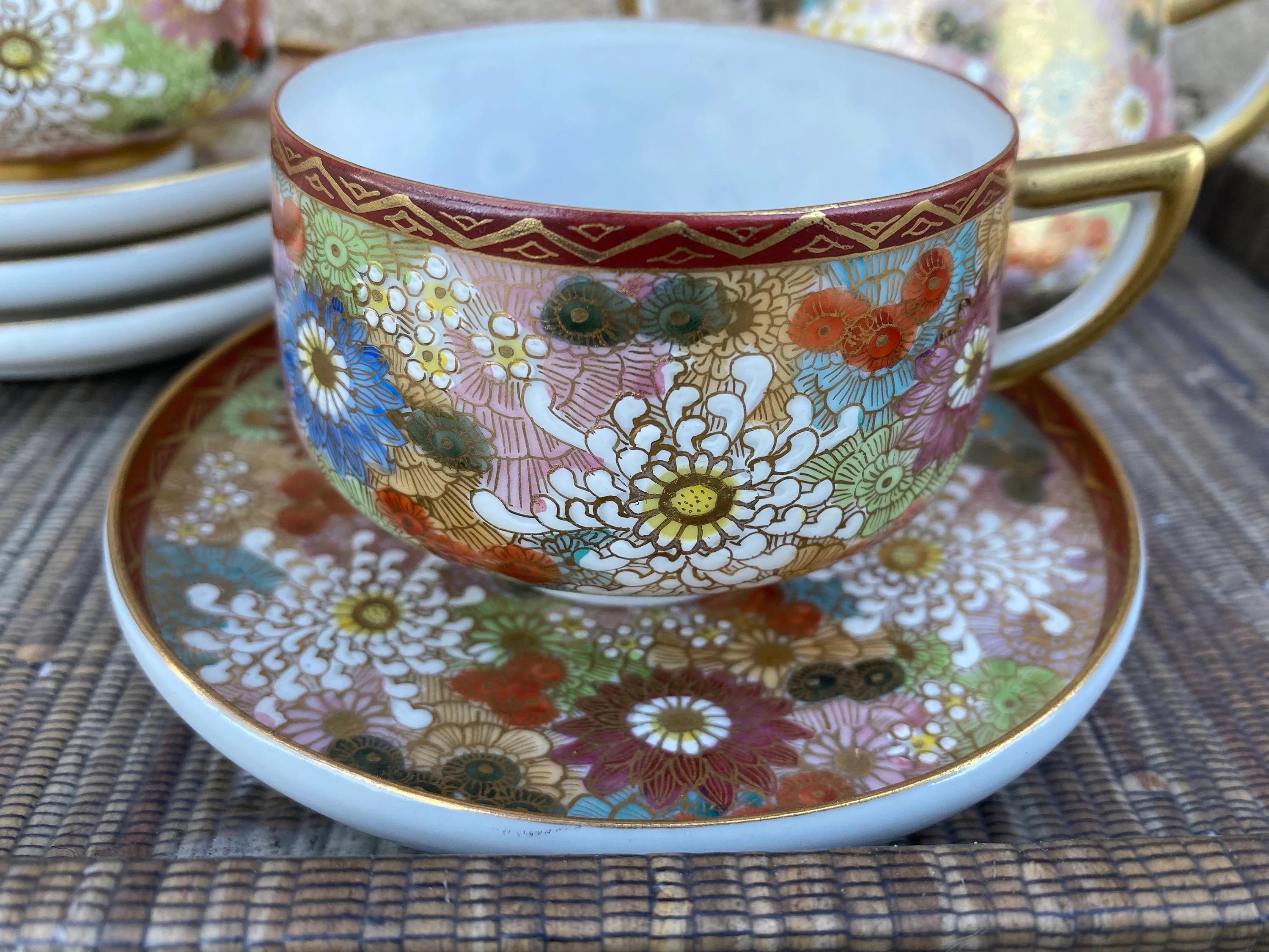 Vintage Japanese Kutani Hand Painted Porcelain Tea Service Set, Thousand Flowers Pattern - Set of 9

Both elegant and modern, this vintage Japanese Kutani porcelain tea service set is hand painted with chrysanthemums, dahlias and a myriad of flowers
