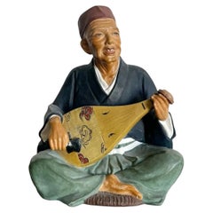 Muñeca japonesa vintage de arcilla de Leftons de un anciano tocando una Biwa