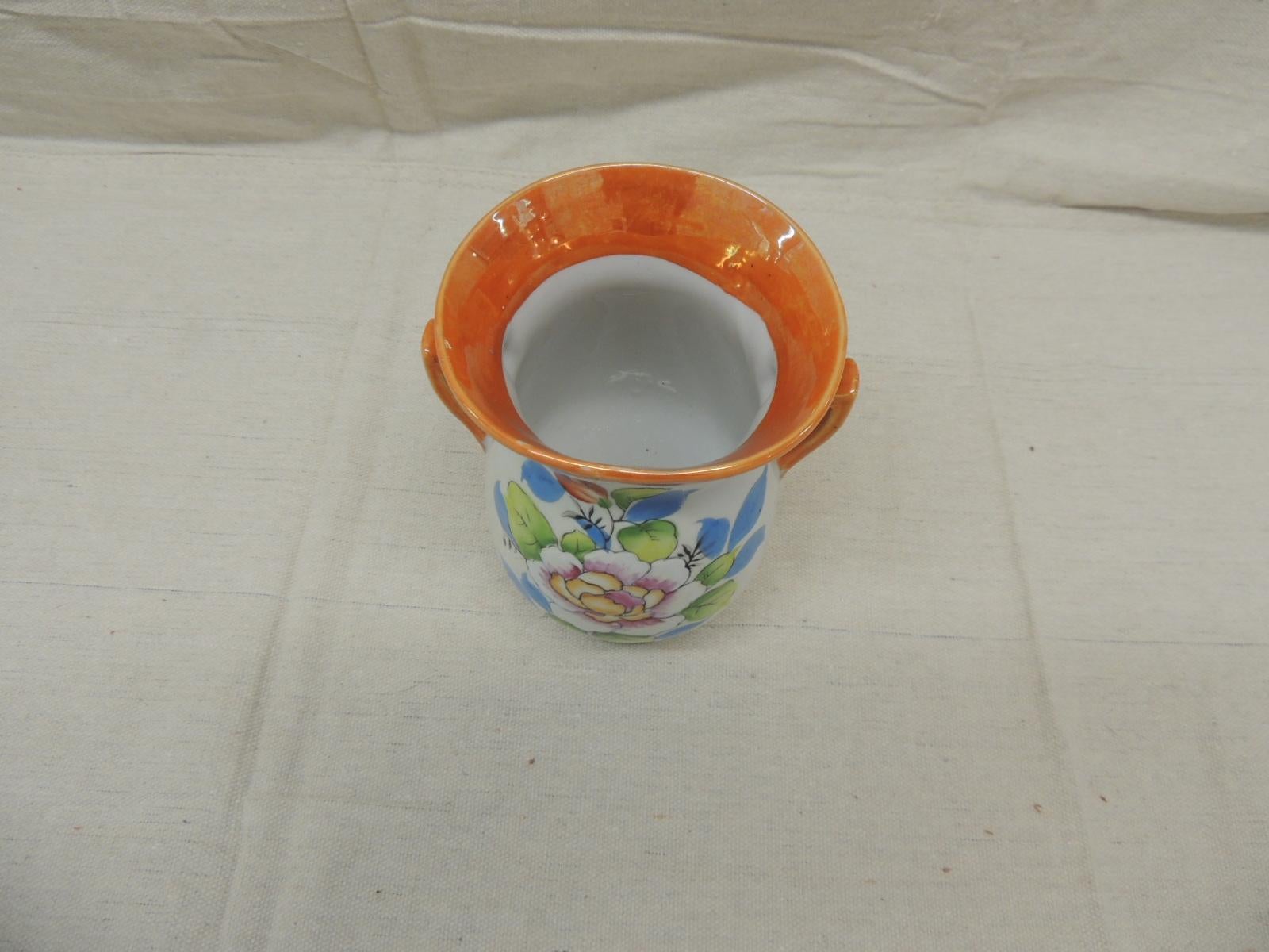 Vintage Japanese Lusterware orange and blue small vase with handles.
Size: 4.5