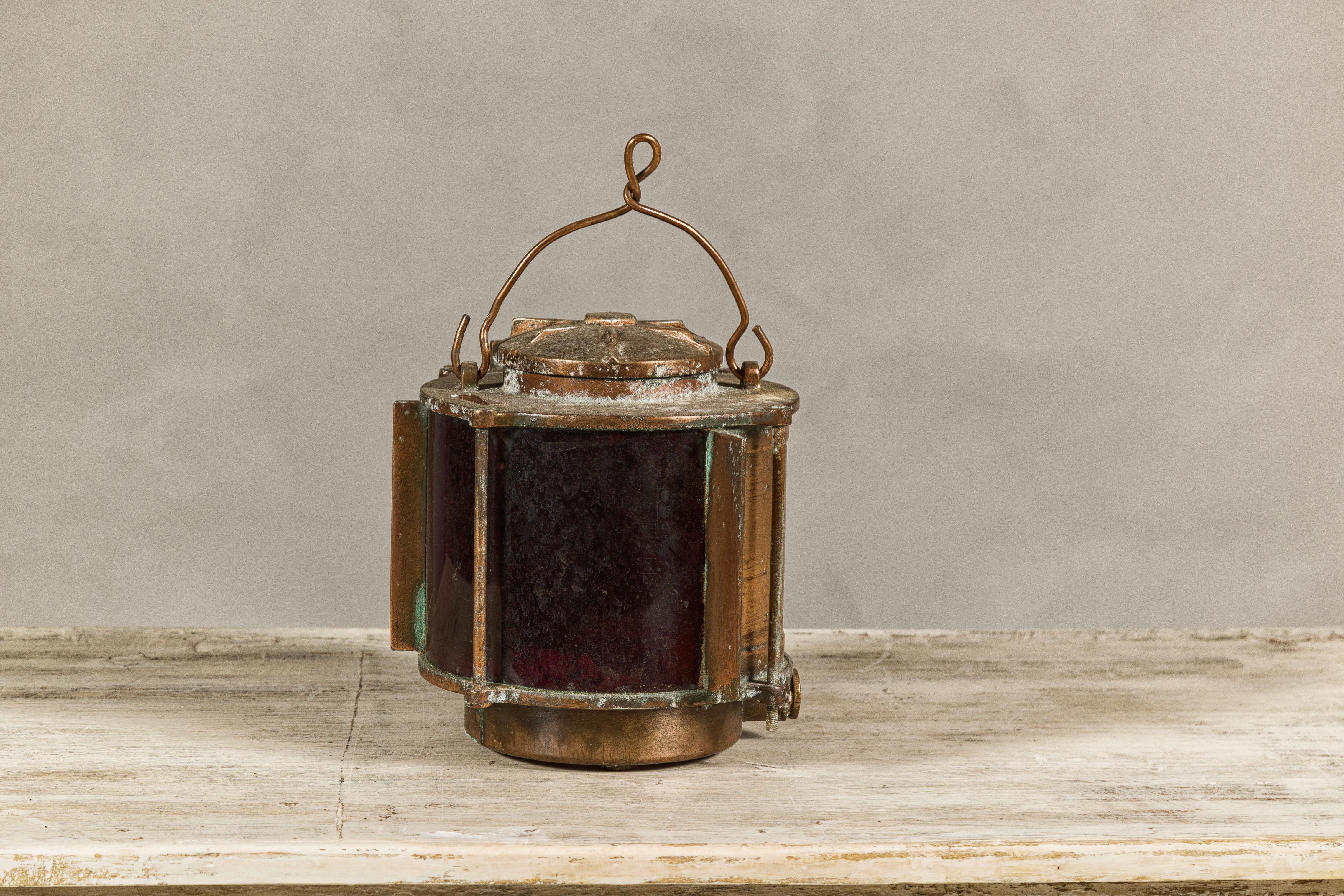 Vintage Japanese Metal Ship Lantern with Red Glass Panel and Weathered Patina In Good Condition In Yonkers, NY