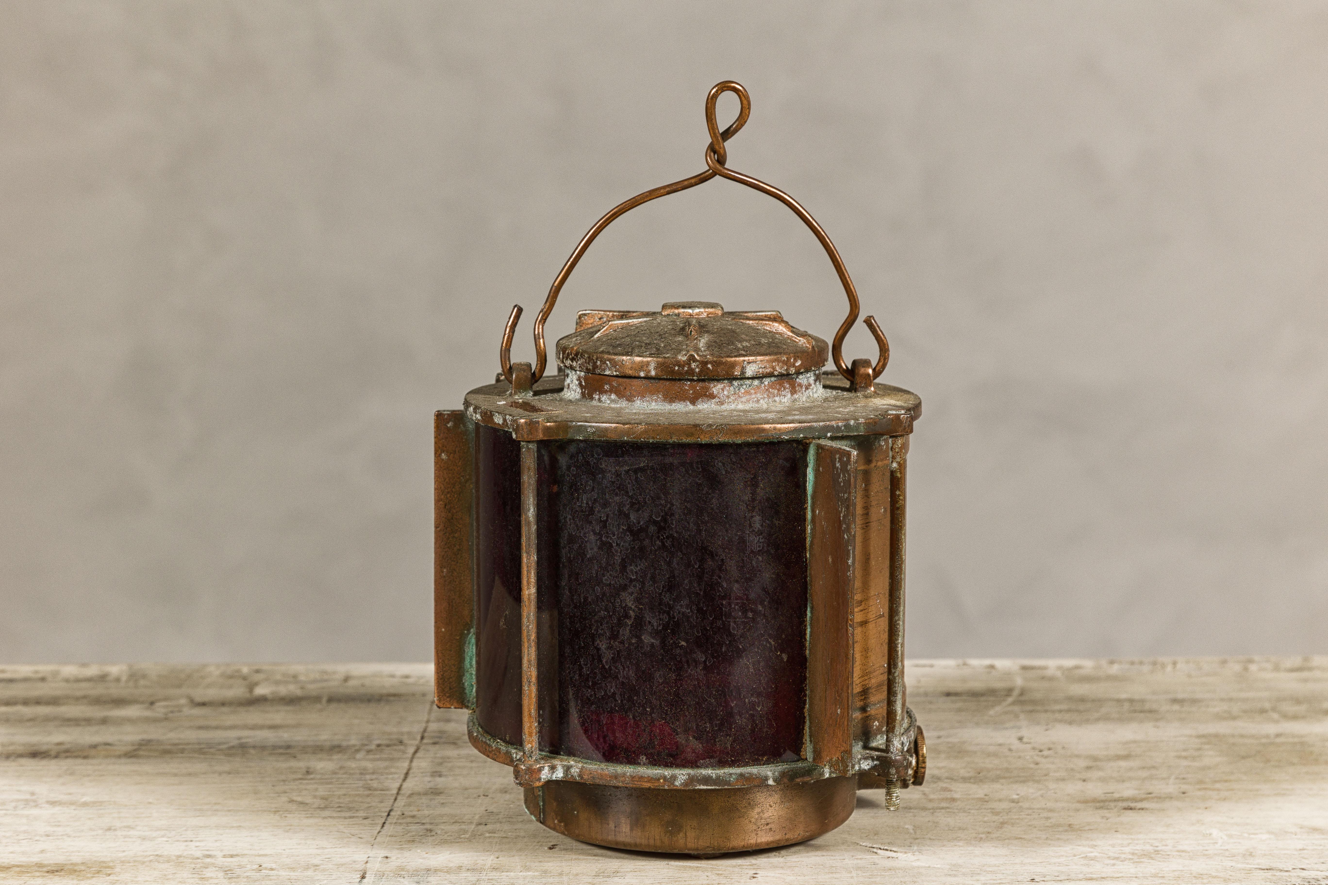 20th Century Vintage Japanese Metal Ship Lantern with Red Glass Panel and Weathered Patina