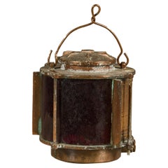 Vintage Japanese Metal Ship Lantern with Red Glass Panel and Weathered Patina
