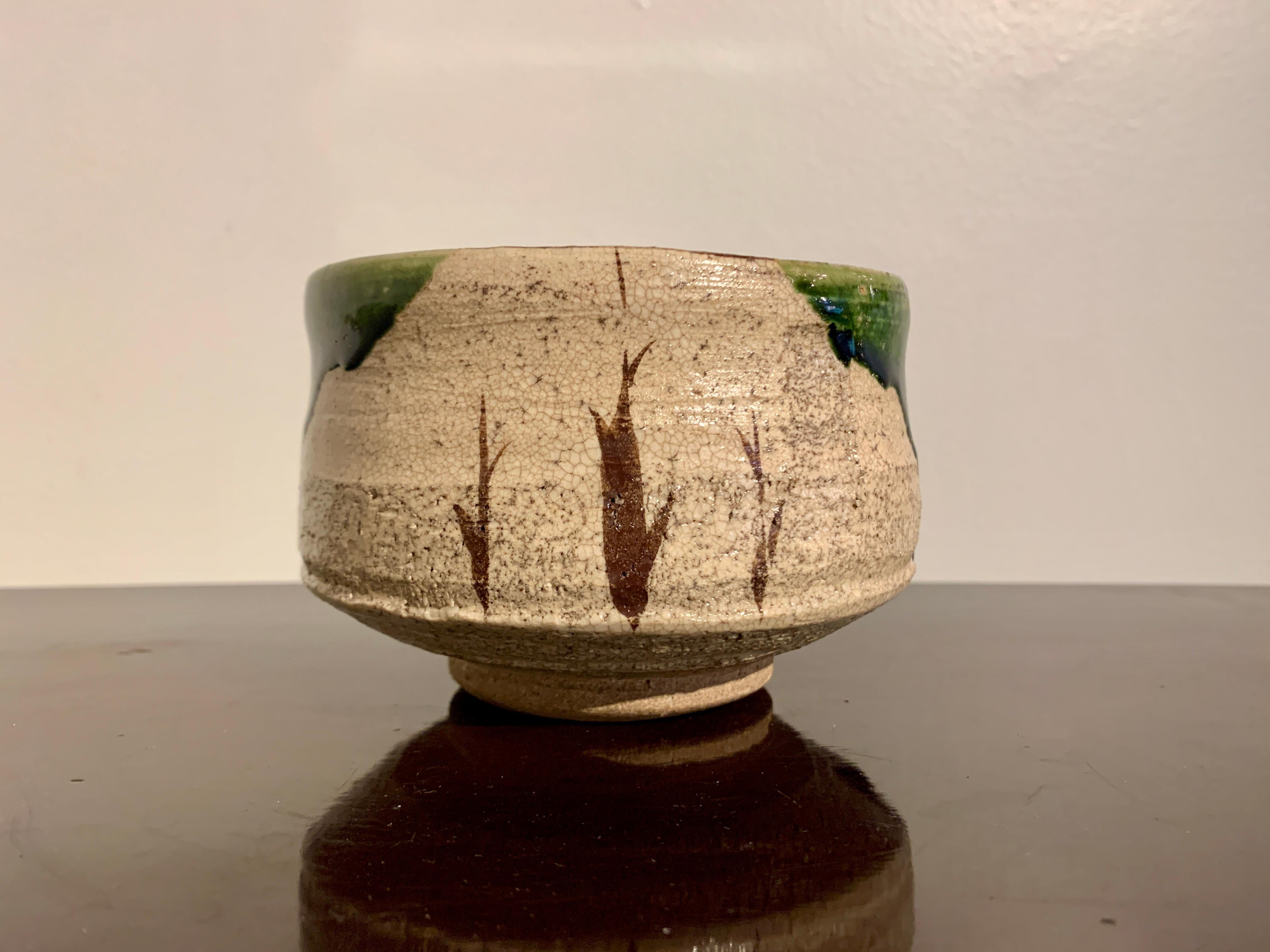 A charming vintage Japanese oribe glazed chawan by Matsumoto Tetsuzan (b. 1955), Seto, Japan. 

The tea bowl, called a chawan, wonderfully potted with a high sides and a deep well. The buff colored stoneware glazed in the typical ao-oribe fashion,