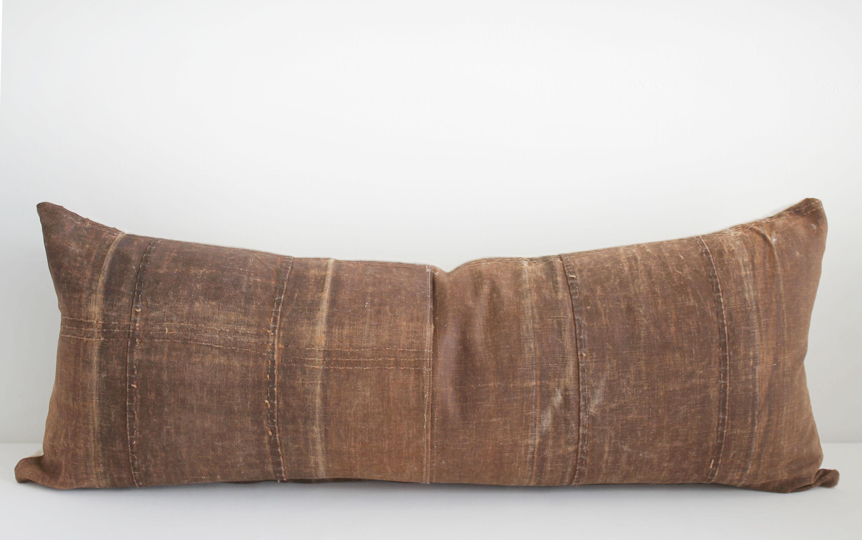 Vintage Japanese sake bottle cover lumbar pillow. Made from old canvas sake bottle covers, in a deep brown, these wonderful patina'd covers have been repurposed into these fabulous lumbar pillows, absolutely one of a kind! Sewn with a zipper