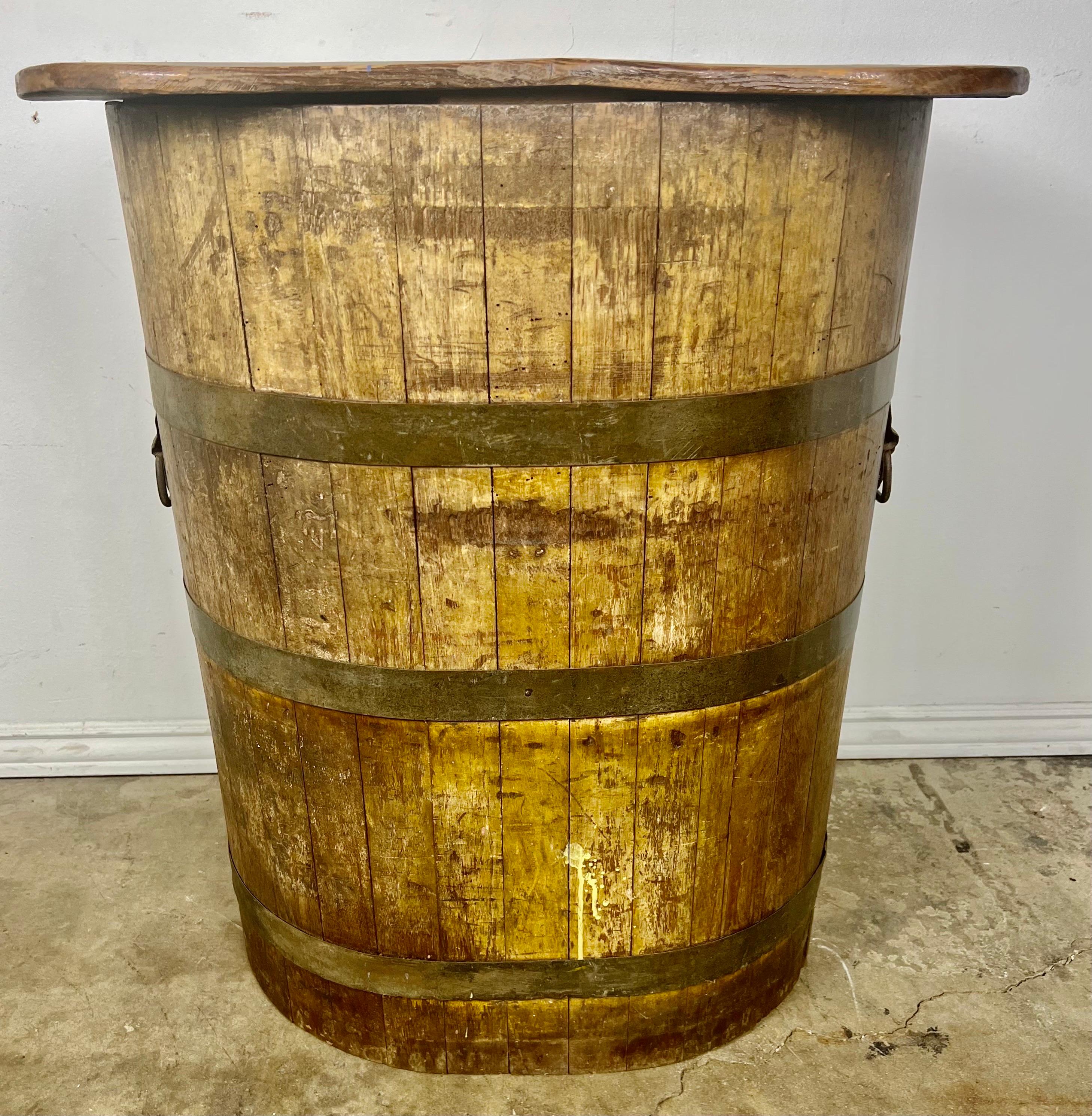 Early 20th century unique Saki Barrel that was converted into a table.  This table would be great between a pair of leather club chairs or as a wine tasting table in your new wine room.