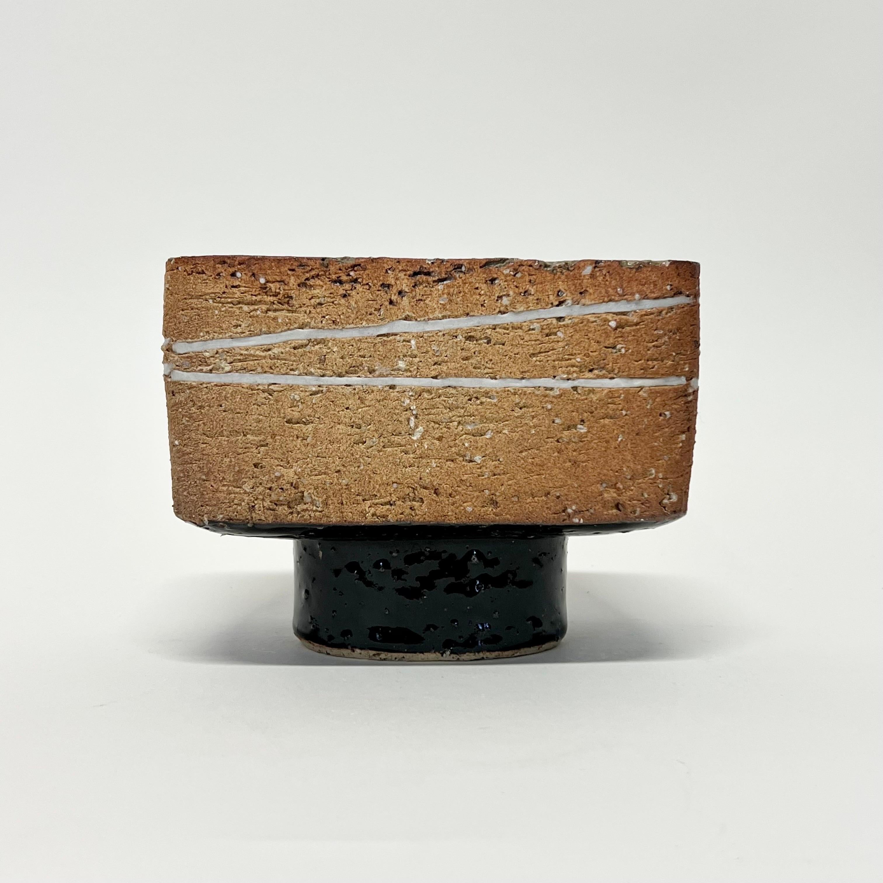 Beautiful studio Ikebana from Shigaraki with incised glazed lines running across, a black glazed base with ash glaze on the inside from the wood firing. Really beautiful example. 