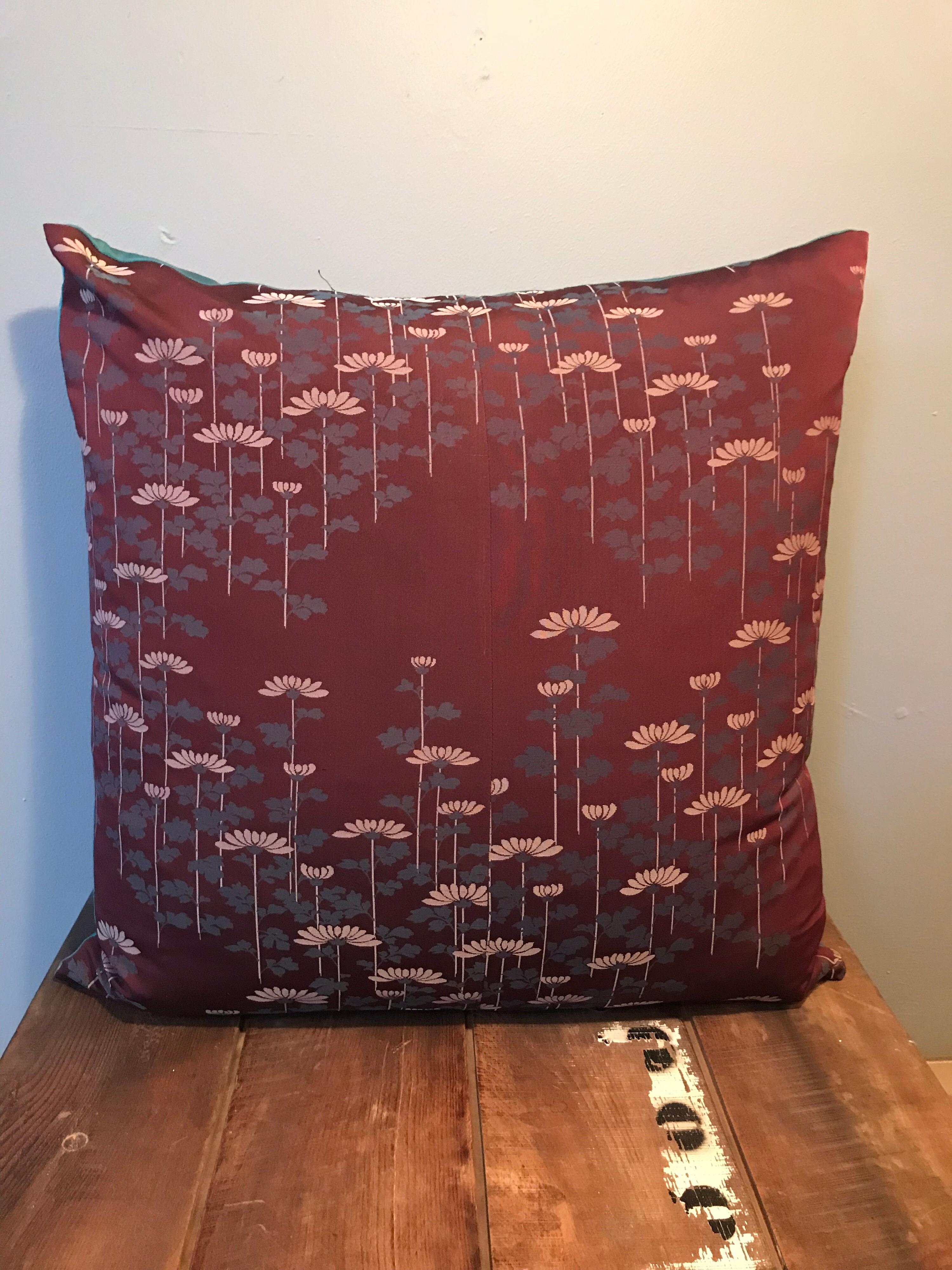 Beautiful and unique set of vintage silk cushions made from a Japanese Kimono.
Each set is unique and made from hand picked kimonos.
This set has lovely embroidered floral patterns and with feather filling.
Measurements are one cushion 50 x 50cm