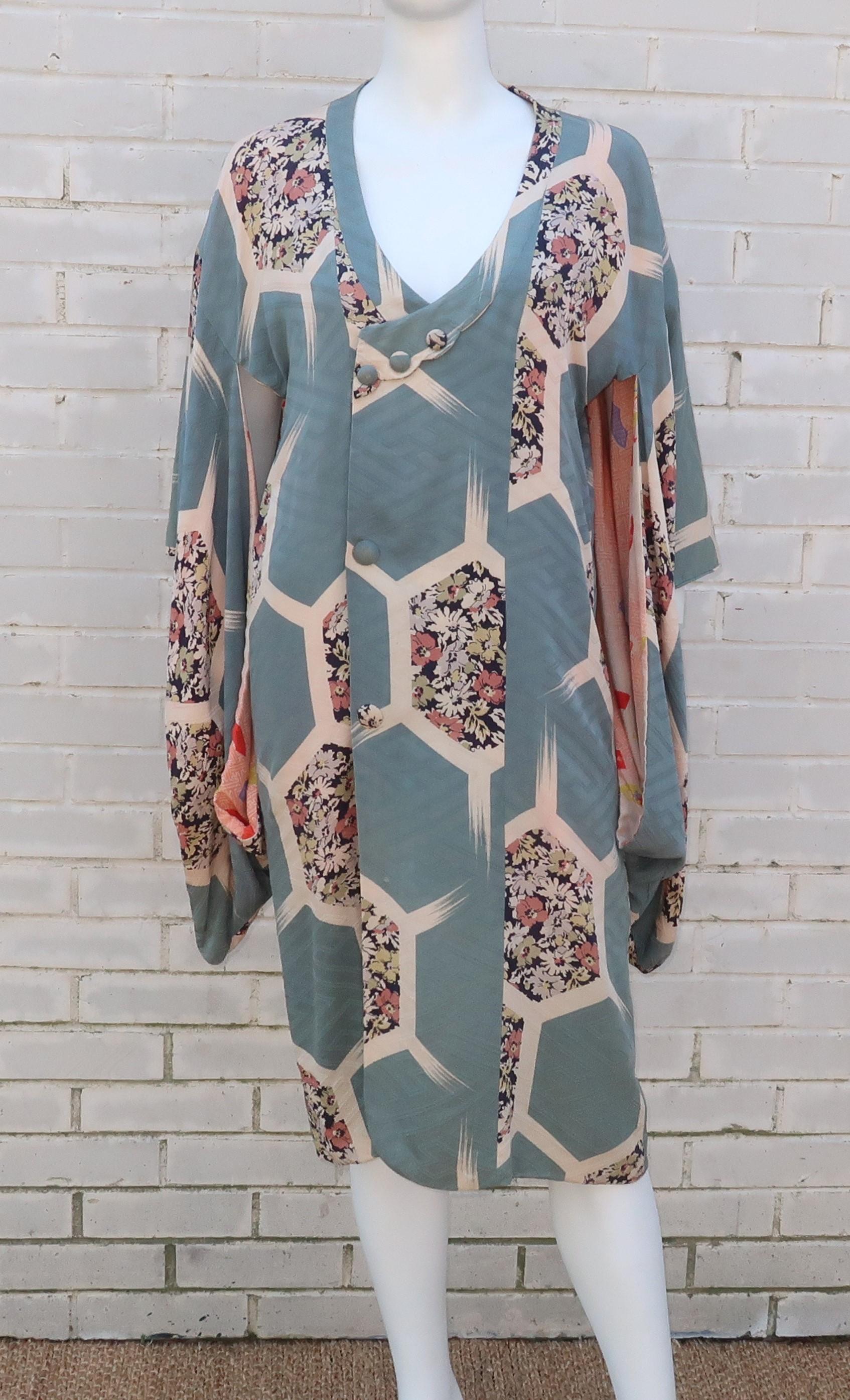 This vintage Japanese silk jacquard robe is reminiscent of the Bohemian era styles of the early 20th Century when artistic women would pair Far Eastern looks with more traditional attire.  The honeycomb pattern is accented with a floral design in