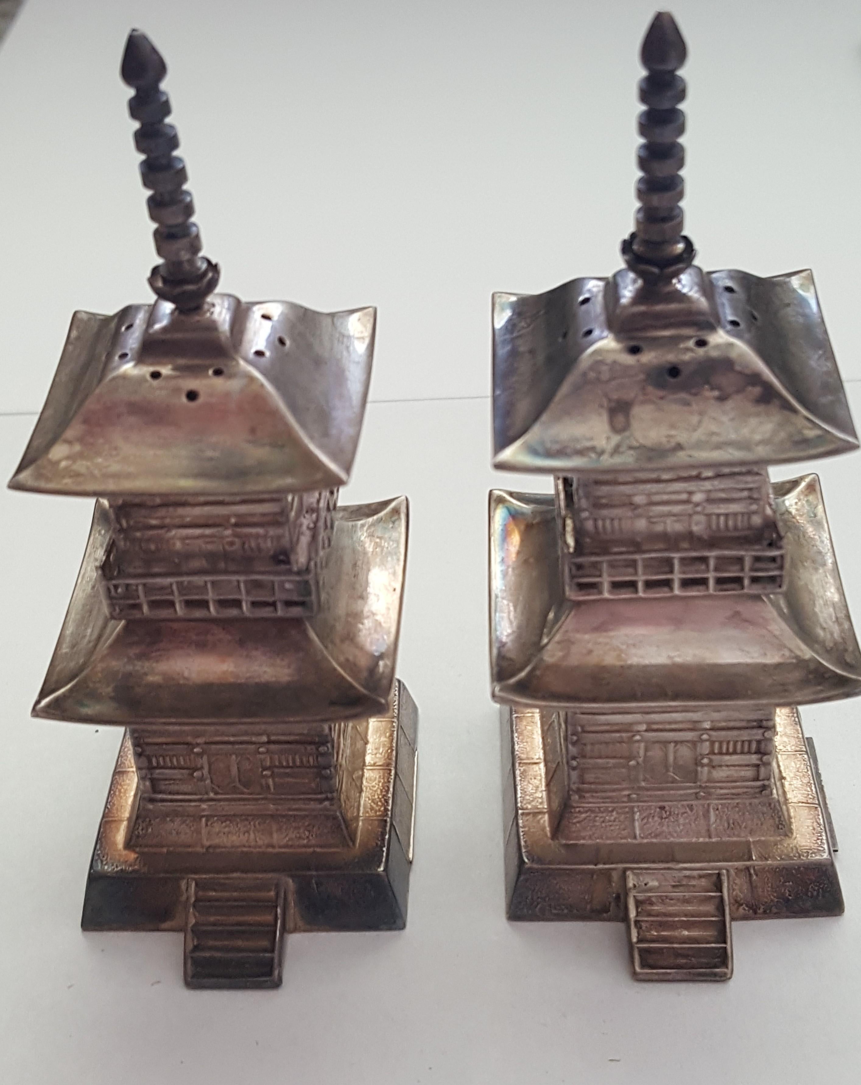 Vintage Japanese Sterling Salt and Pepper Shakers Pagoda Okubo, Excellent Condition, 72.2 Grams, 3 1/4 Inches tall, I + Inch Square Wide

These salt and pepper shakers make a nice addition to a silver collection. We are selling other Asian salt and