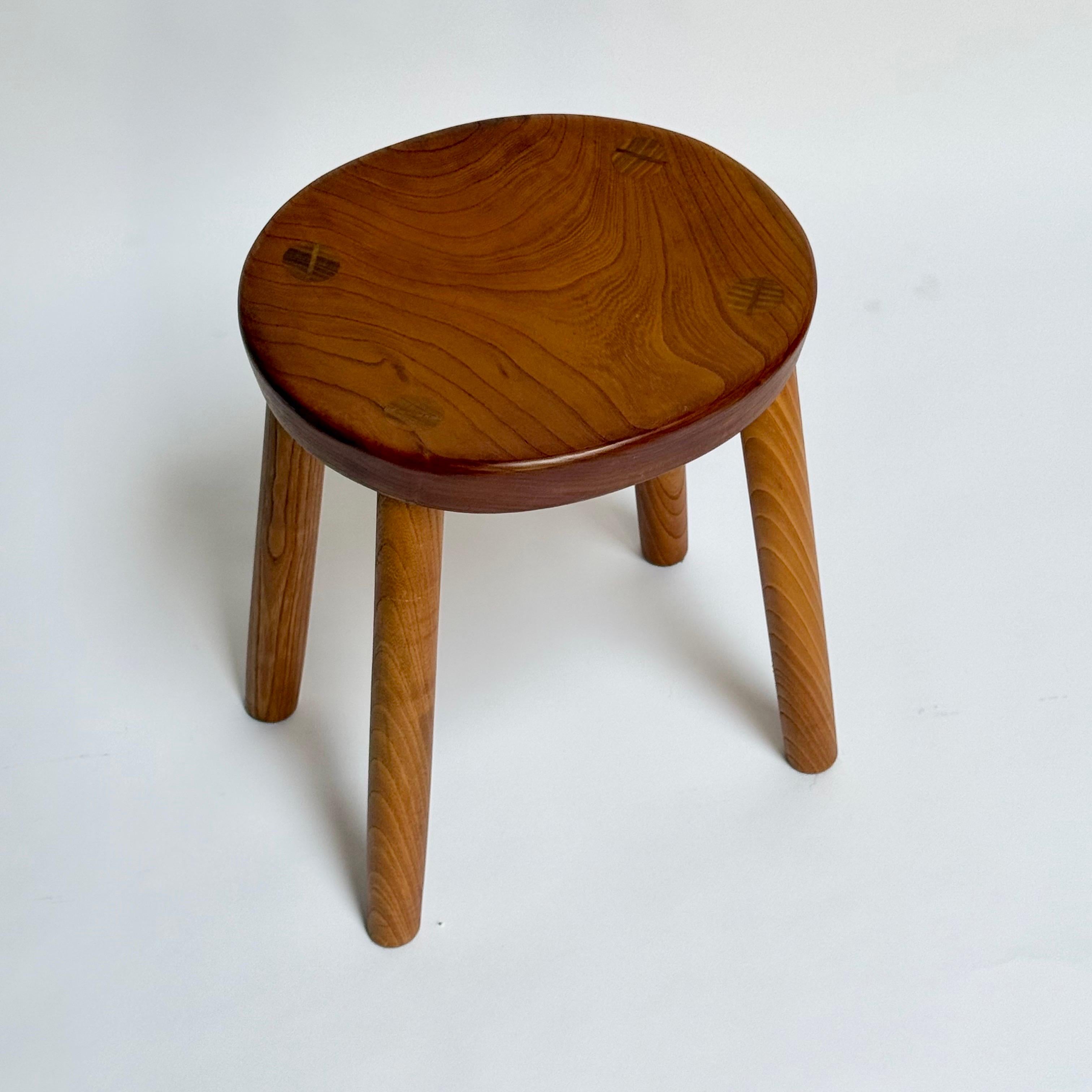 Fantastic vintage Japanese studio craft stool. Incredible details, and the concave top makes it comfortable to sit on. Stunning wood grain throughout the entire piece. 