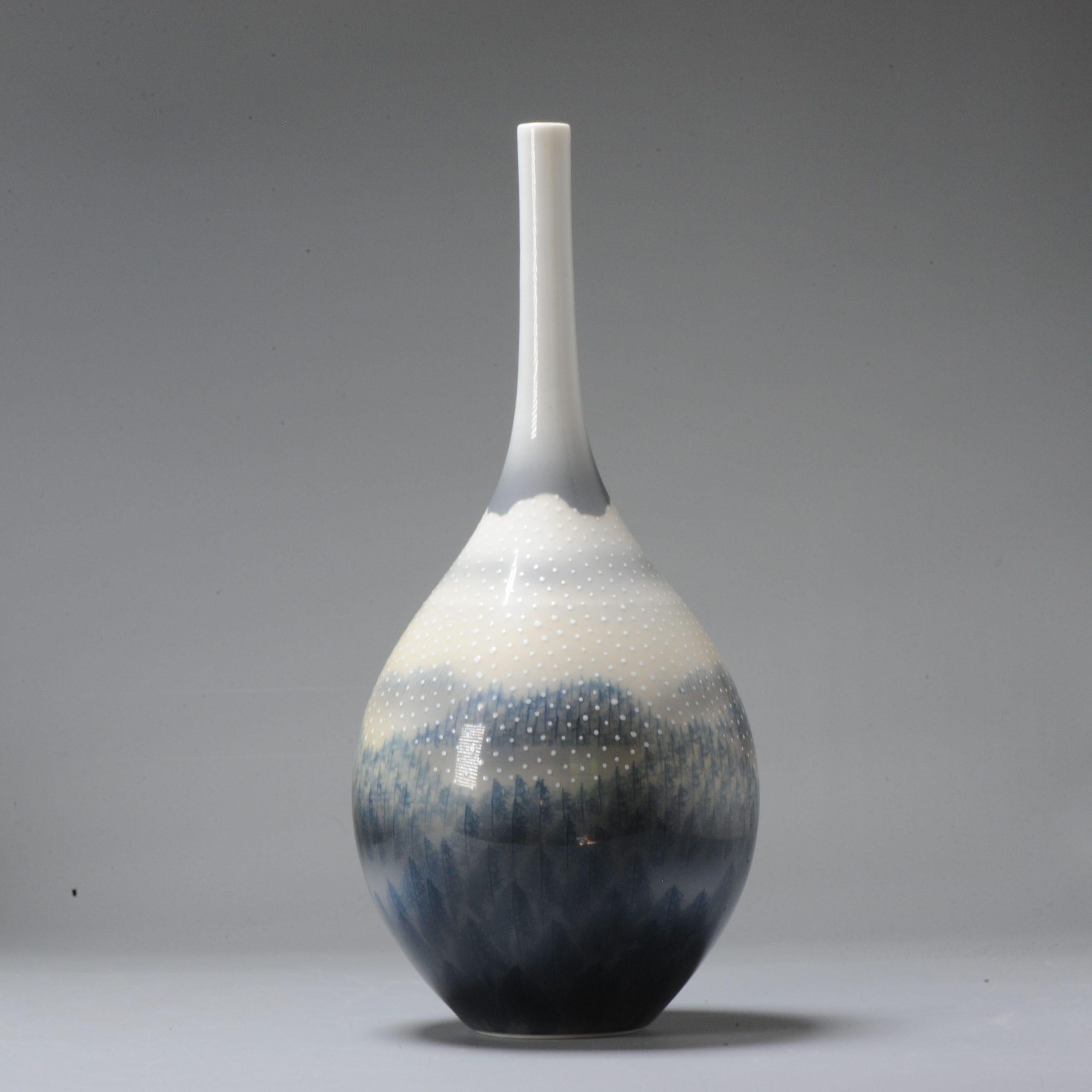 Lovely and rare piece.

A superb porcelain vase, with a night winter landscape. Made by Fuji Shumei

Fujii Mr. Aki Fujii's specialty is the technique of drawing a mountain by simulating the veins of a leaf, called the “leaf technique”, as if it