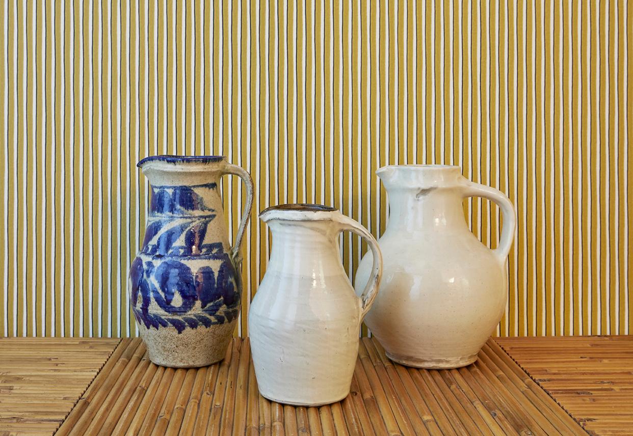 Japan, 2015

Lovely white glazed pitcher with handle. Centre jug in the photo. 

Bernard Leach visited Onta pottery and taught the potters to make jugs with pulled handles in the English tradition.

Measures: H 23 x Ø 14 cm.