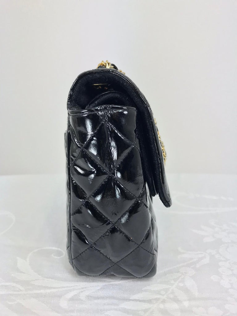 Vintage Jay Herbert quilted flap black patent leather chain handbag from the 1960s. This double flap bag is a good substitute for your Chanel double flap bag. Quilted black patent leather with double gold chain handles. The outer flap is quilted to
