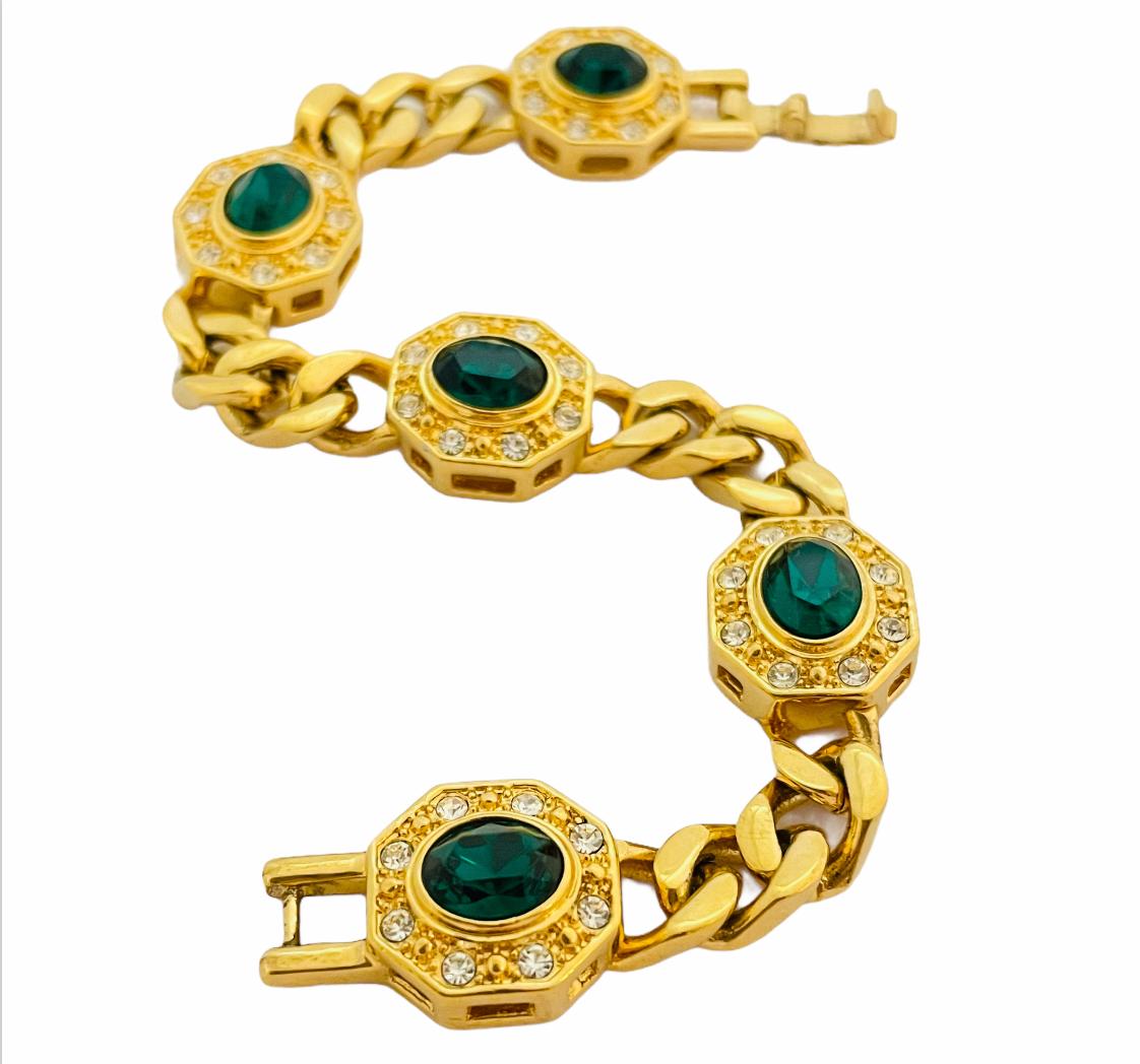 DETAILS

• signed JBK

• gold tone with clear and green crystals

• vintage designer runway bracelet

MEASUREMENTS

• 7.25