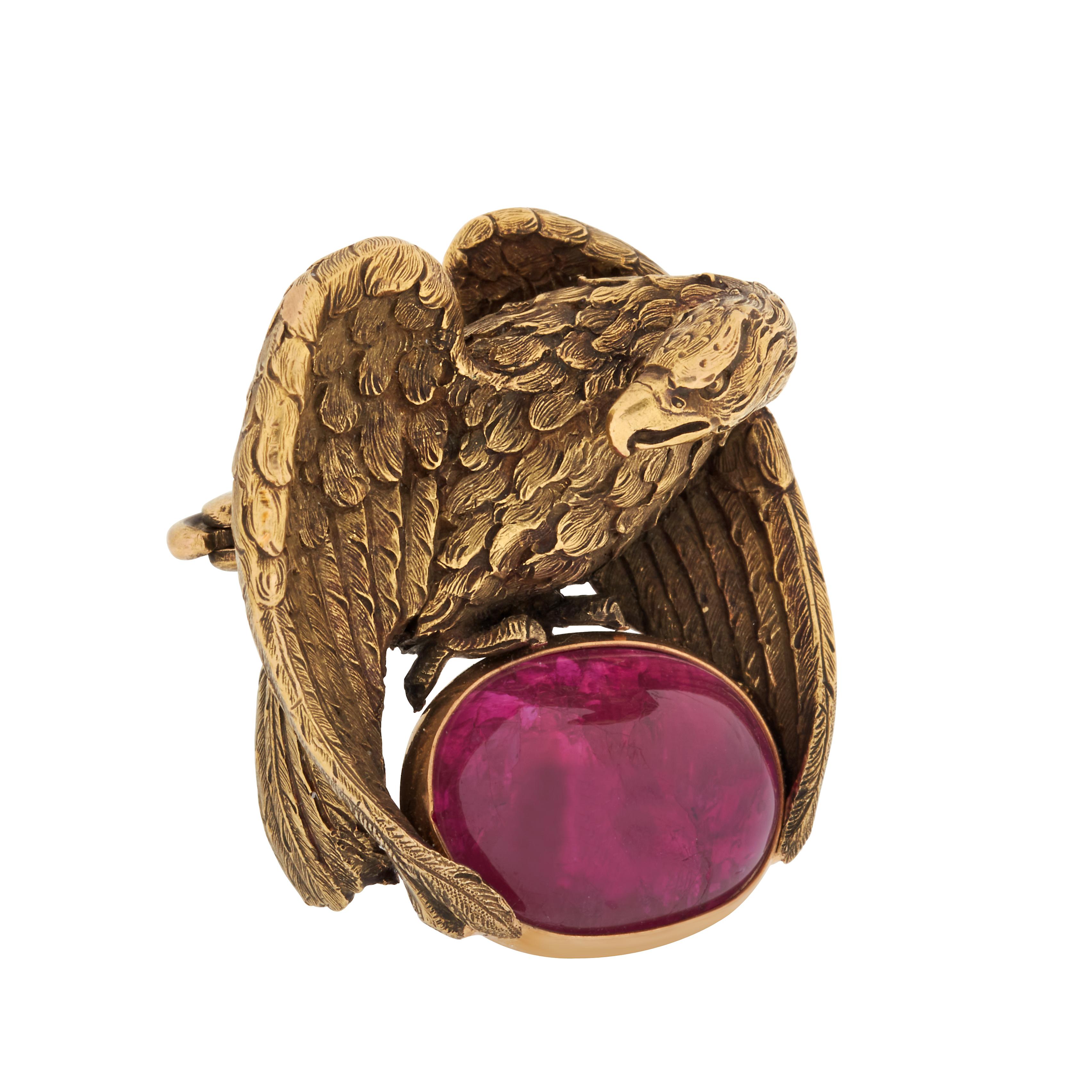 Vintage J.E. Caldwell & Co. cabochon ruby eagle brooch set in 18k yellow gold.  

This striking realistic eagle brooch features a bezel set 13.94 carat unheated oval cabochon ruby accompanied by an AGL brief report.  The ruby measures 14.73 x 10.87