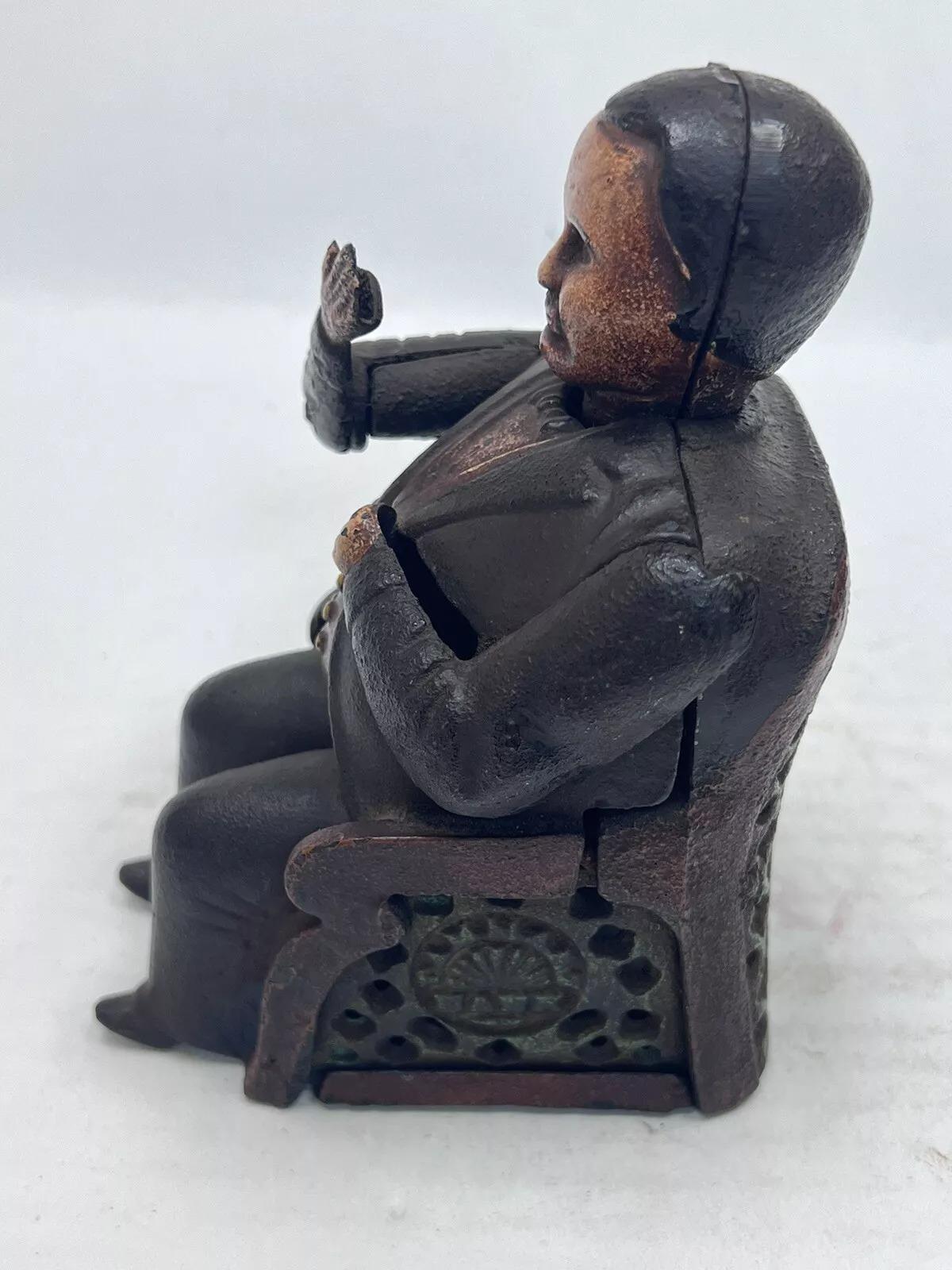 Vintage Reproduction J.E. Stevens Cast Iron Still Bank Tammany Hall Politician Coin Piggy Bank. Circa Late 20th Century. Measurements: 5.5
