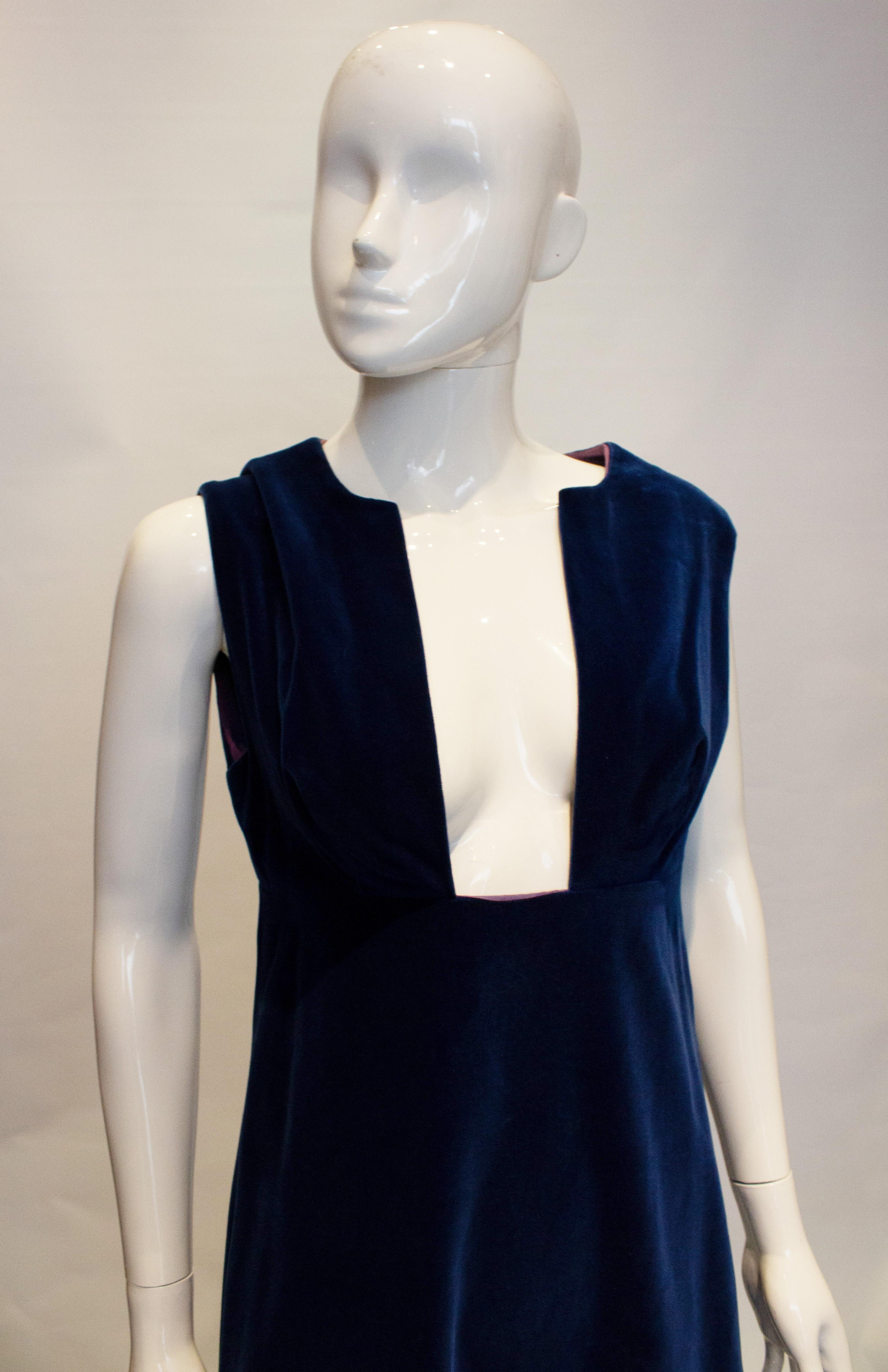 A charming and chic vintage velvet dress by Jean Allen.  The dress has deep front, central back zip and is fully lined. Simple but a stunning shape. 
Measurements Bust  37'',  length 56''