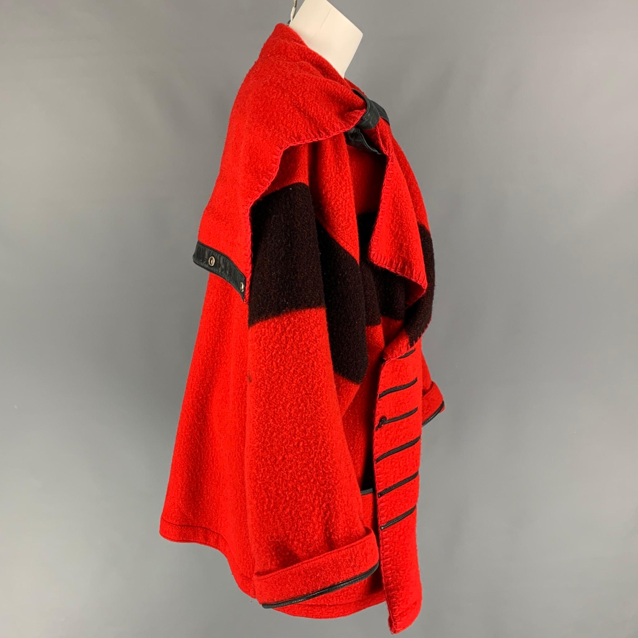 Vintage JEAN-CHARLES DE CASTELBAJAC coat comes in a red & black wool featuring a oversized fit, large lapel, leather trim, front pockets, and a double breasted closure. Made in France. 

Good Pre-Owned Condition.
Marked: Size tag