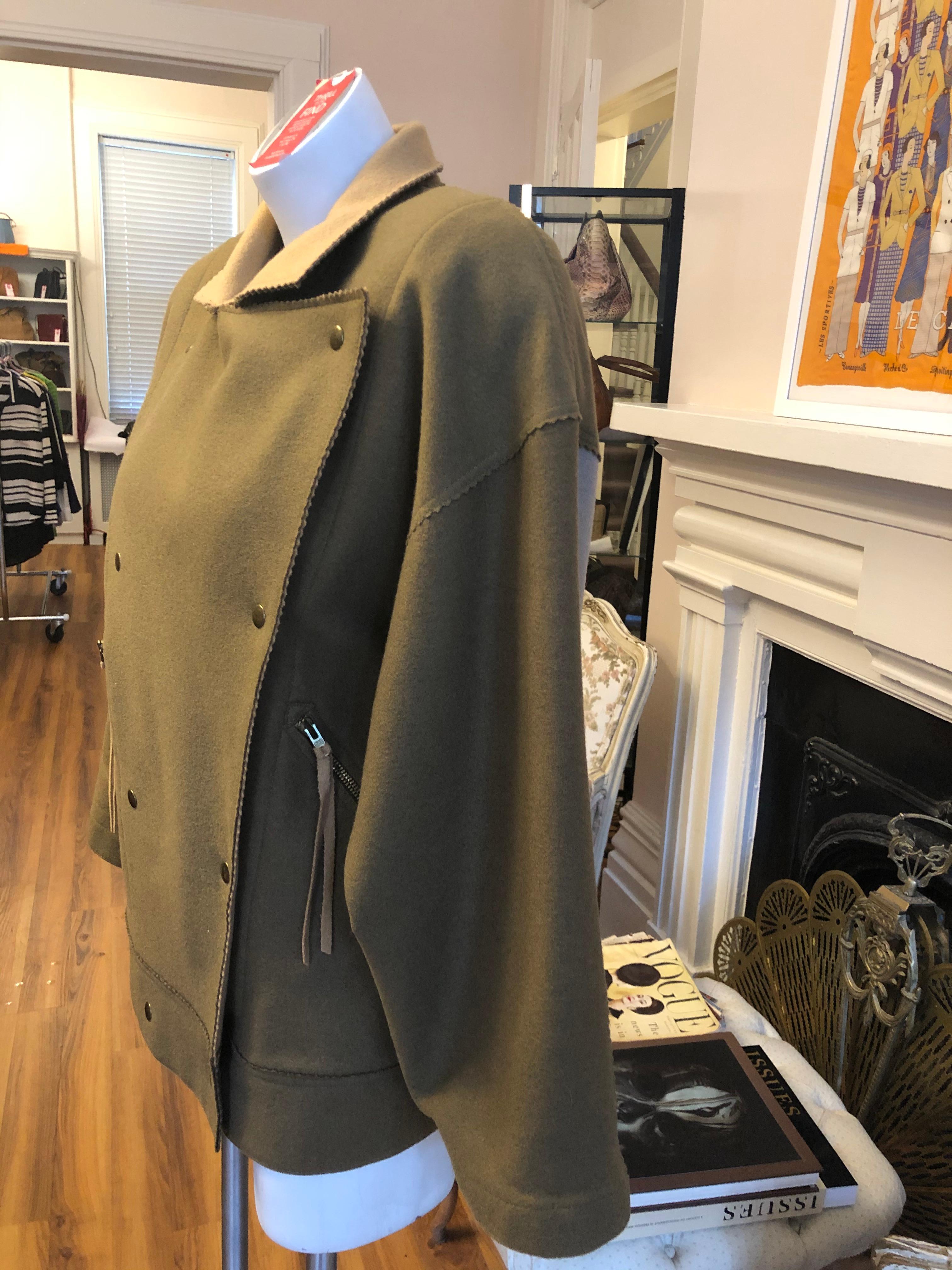 I believe this is a 1970s vintage as it was made for J.C de Castelbajac mother's company KO and CO. He is know for his interesting design and this is definitely one of them. The outdoor jacket is made of 100% virgin wool; has to front zipped