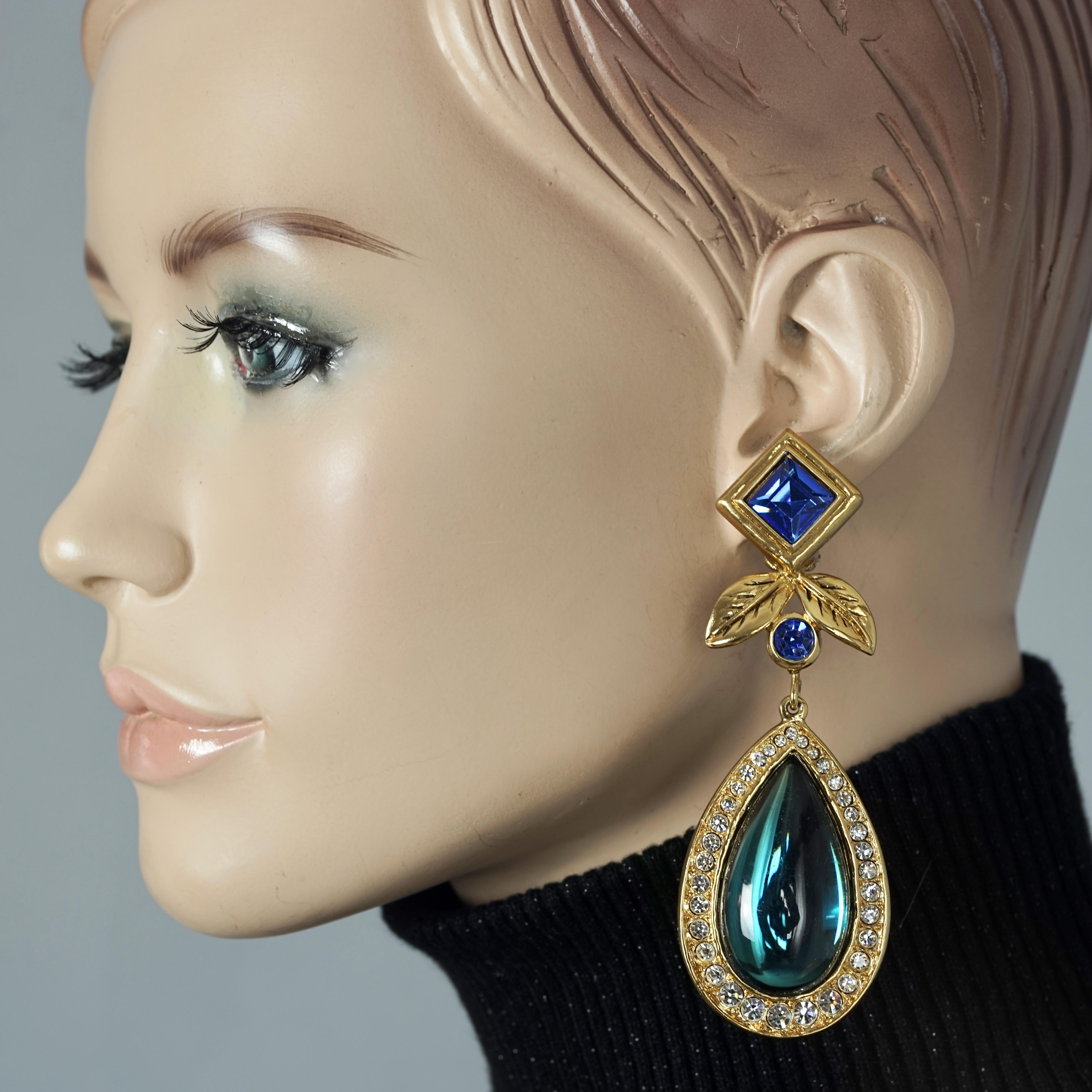 Vintage JEAN LOUIS SCHERRER Geometric Jeweled Drop Earrings

Measurements:
Height: 3.81 inches (9.7 cm)
Width: 1.33 inches (3.4 cm)
Weight per Earring: 36 grams

Features:
- 100% Authentic JEAN LOUIS SCHERRER.
- Massive and long geometric jeweled