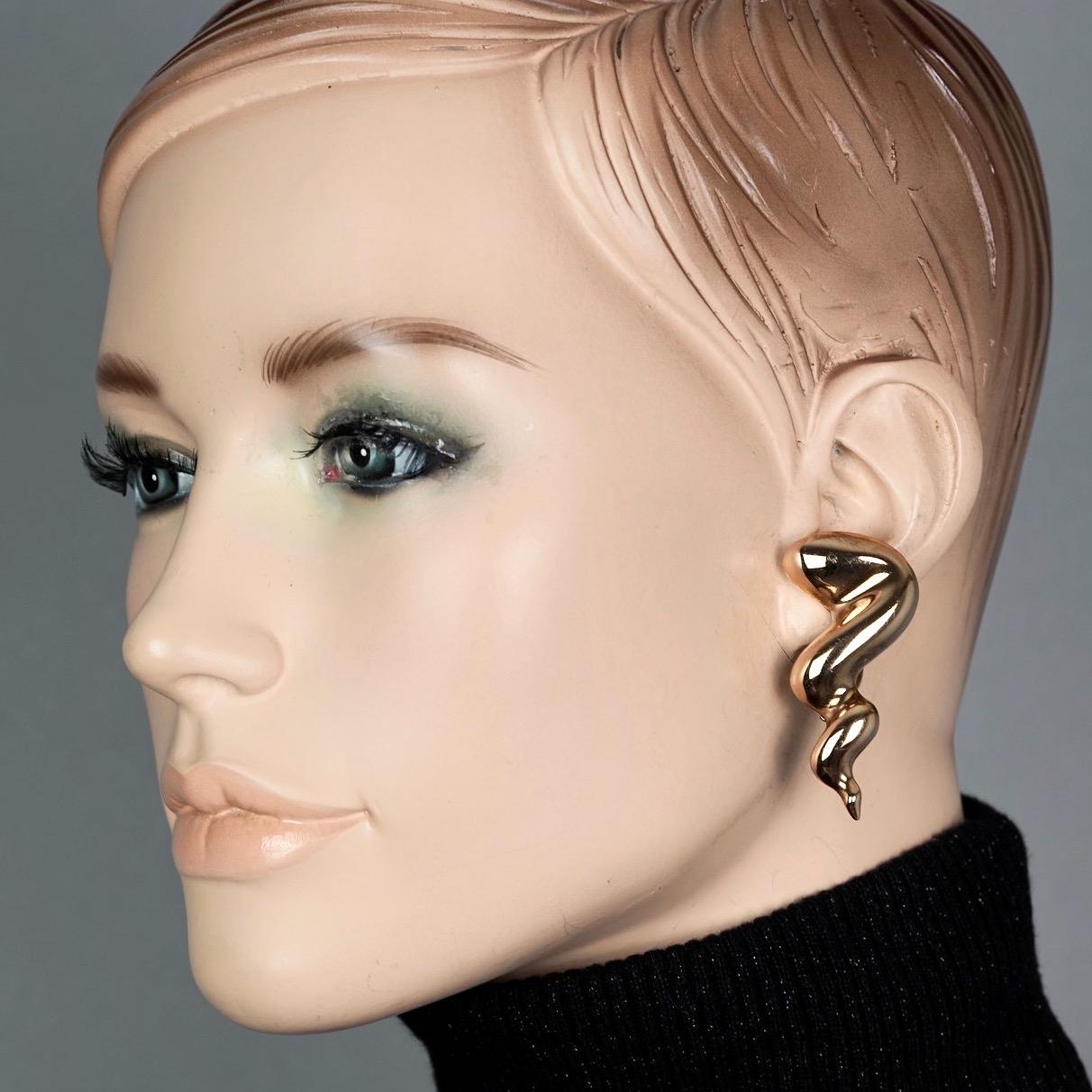 Vintage JEAN LOUIS SCHERRER Gilt Spiral Horn Novelty Earrings

Measurements:
Height: 1.97 inches (5 cm)
Width: 0.86 inch (2.2 cm)
Weight per Earring: 13 grams

Features:
- 100% Authentic JEAN LOUIS SCHERRER.
- Gilt spiral horn novelty earrings.
-