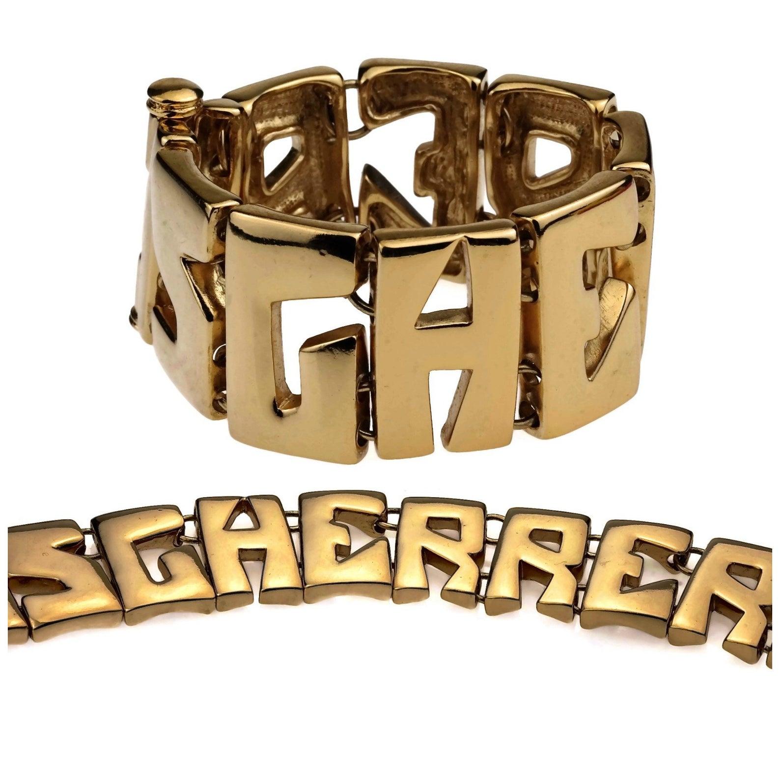 Vintage JEAN LOUIS SCHERRER Letters Spelled Out Bracelet

Measurements:
Height: 1.30 inches (3.3 cm)
Wearable Length: 7.48 inches (19 cm)

Features:
- 100% Authentic JEAN LOUIS SCHERRER.
- Unique spelled out SCHERRER letters bracelet.
- Gold tone.
-