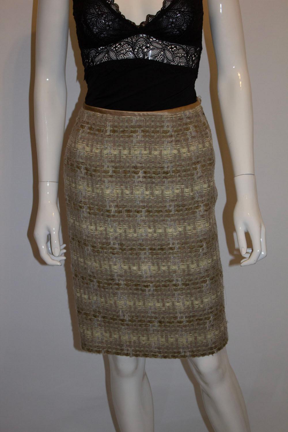 A stunning vintage skirt by Jean Muir , main line. In a wool mix , and attractive colour mix of olive, ivory and pale green.
The skirt has a side zip opening, 8'' slit at the back and is fully lined.
UK size 8, measurements waist 25'', length 22''