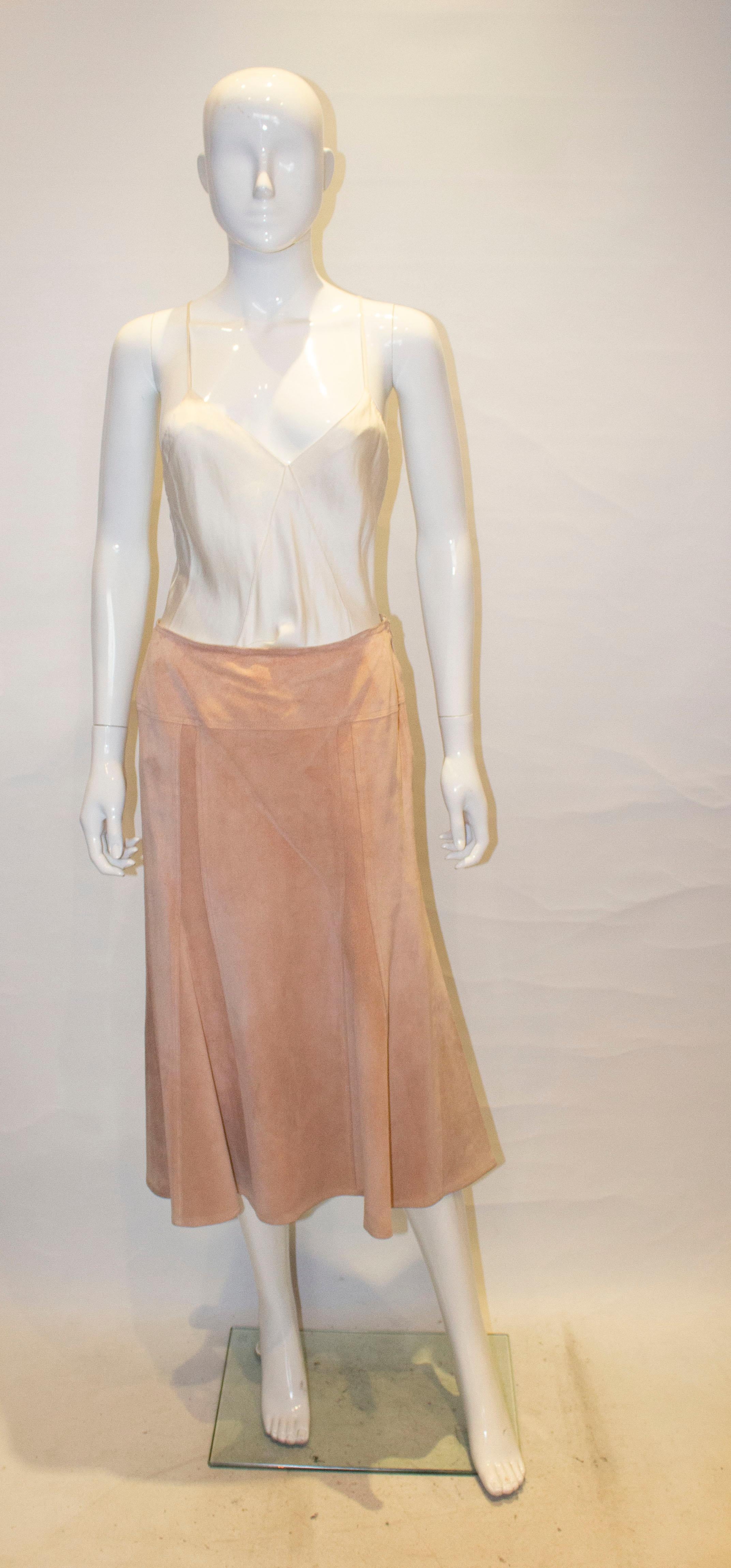 A pretty vintage  suede skirt by Jean Muir , Studio line. The skirt is unlined with a side zip opening.