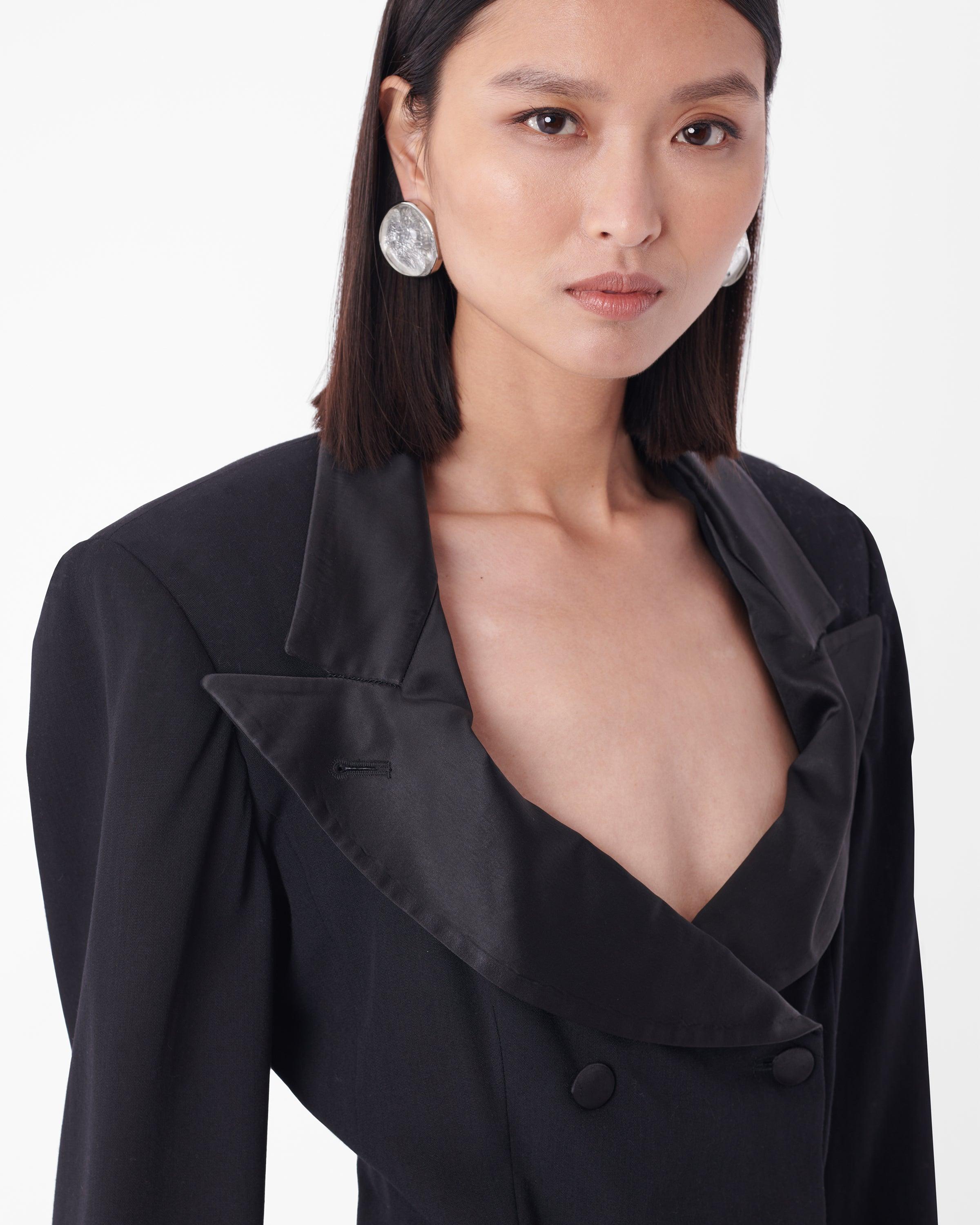Iconic Jean Paul Gaultier 1988 padded blazer, the navy version was seen on Madonna during her Blonde Ambitions tour. Features satin lapels, buttons and piping and curved silhouette to accentuate waistline with double breasted button closure. In