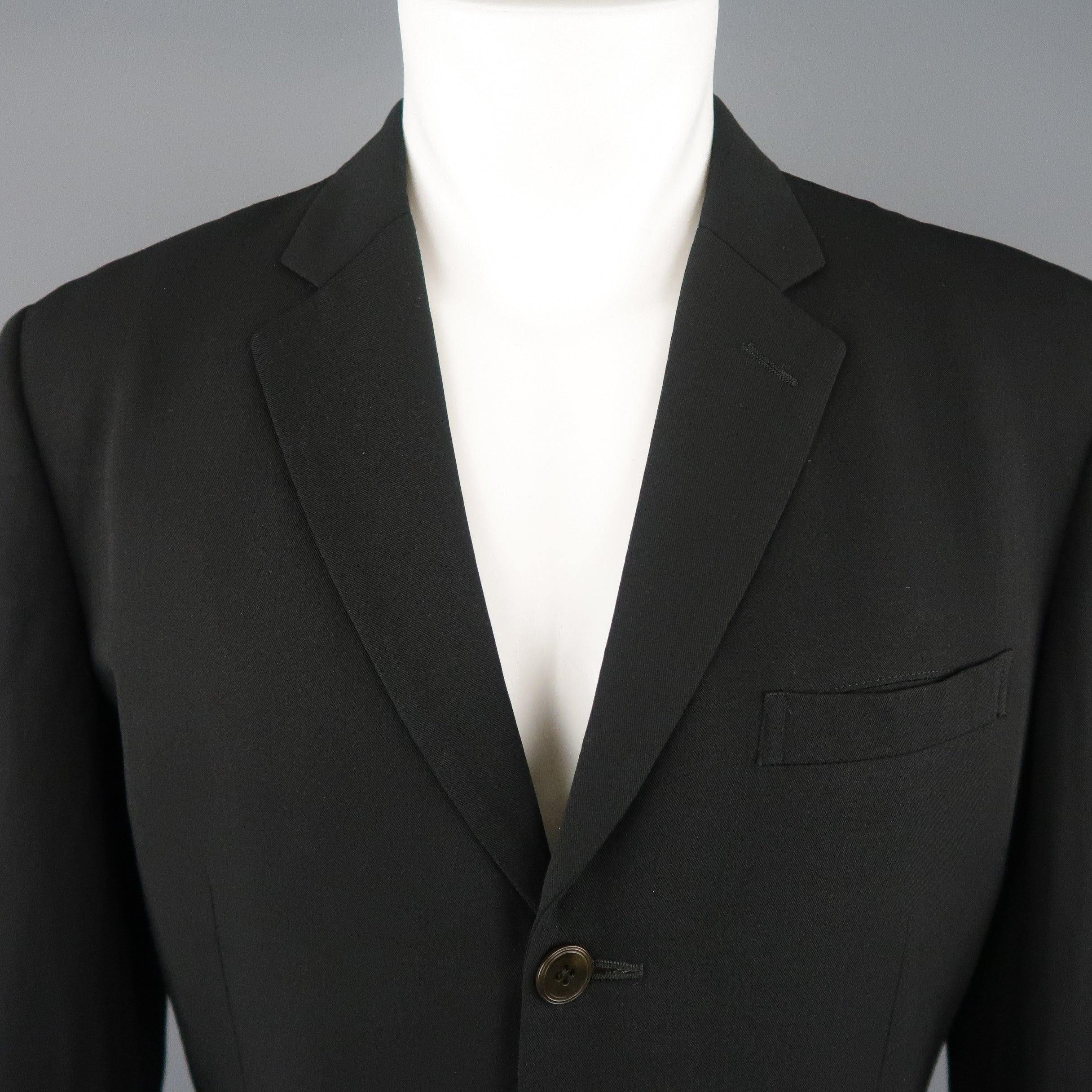 Vintage 1980's OBJET by JEAN PAUL GAULTIER sport jacket comes in wool twill with a notch lapel, three button single breasted front, flap pockets, ventless back, and signature tab detail. 
Very Good Pre-Owned Condition.
 

Marked:   IT 48 M

