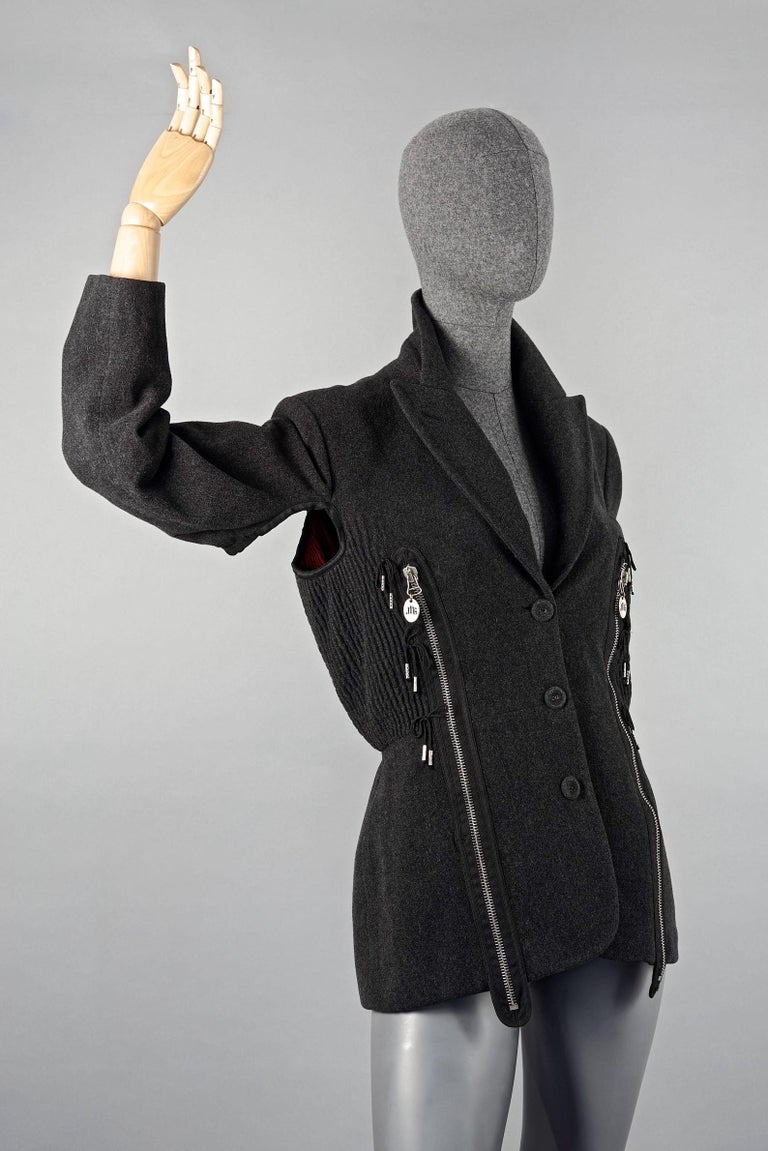 Vintage JEAN PAUL GAULTIER Avant Garde Zippered Arm Hole Wool Blazer Jacket

Measurements taken laid flat, please double bust and waist:
Shoulder: 17.32 inches (44 cm)
Sleeves: 21.65 inches (55 cm)
Bust: 19.29 inches (49 cm)
Waist: 15.74 inches (40