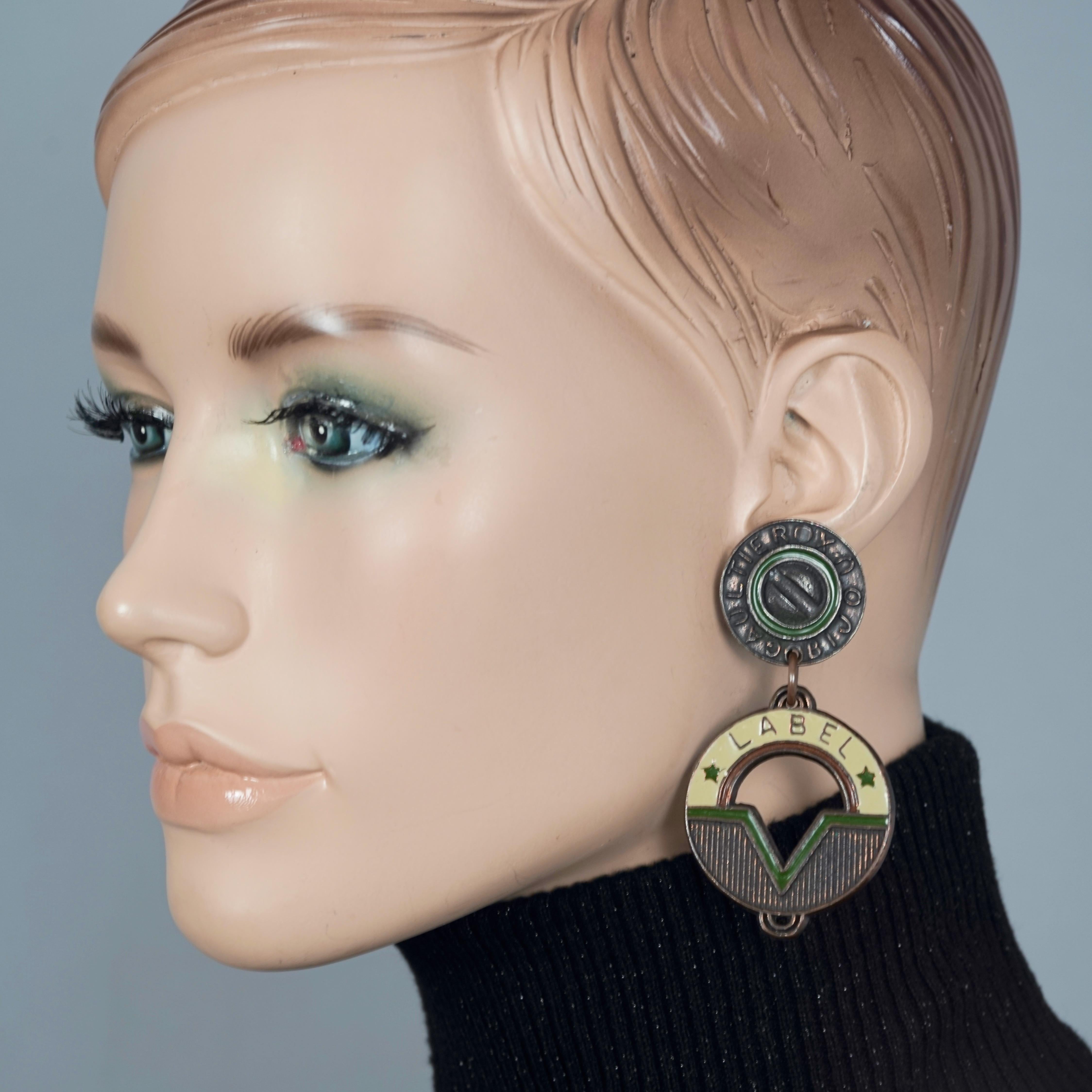 Vintage JEAN PAUL GAULTIER Bijoux Label Enamel Steampunk Earrings

Measurements:
Height: 2.95 inches (7.5 cm)
Width: 1.96 inches (5 cm)
Weight per Earring: 23 grams

Features:
- 100% Authentic JEAN PAUL GAULTIER.
- Dangling Strampunk enamel earrings