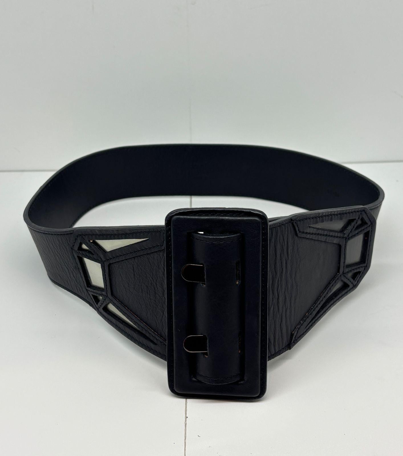 Vintage JPG waist belt with geometric pvc cut outs. Just a simple all black statement belt to complete any look. Size 85. Light wrinkling and scuffs on thr leather surface.