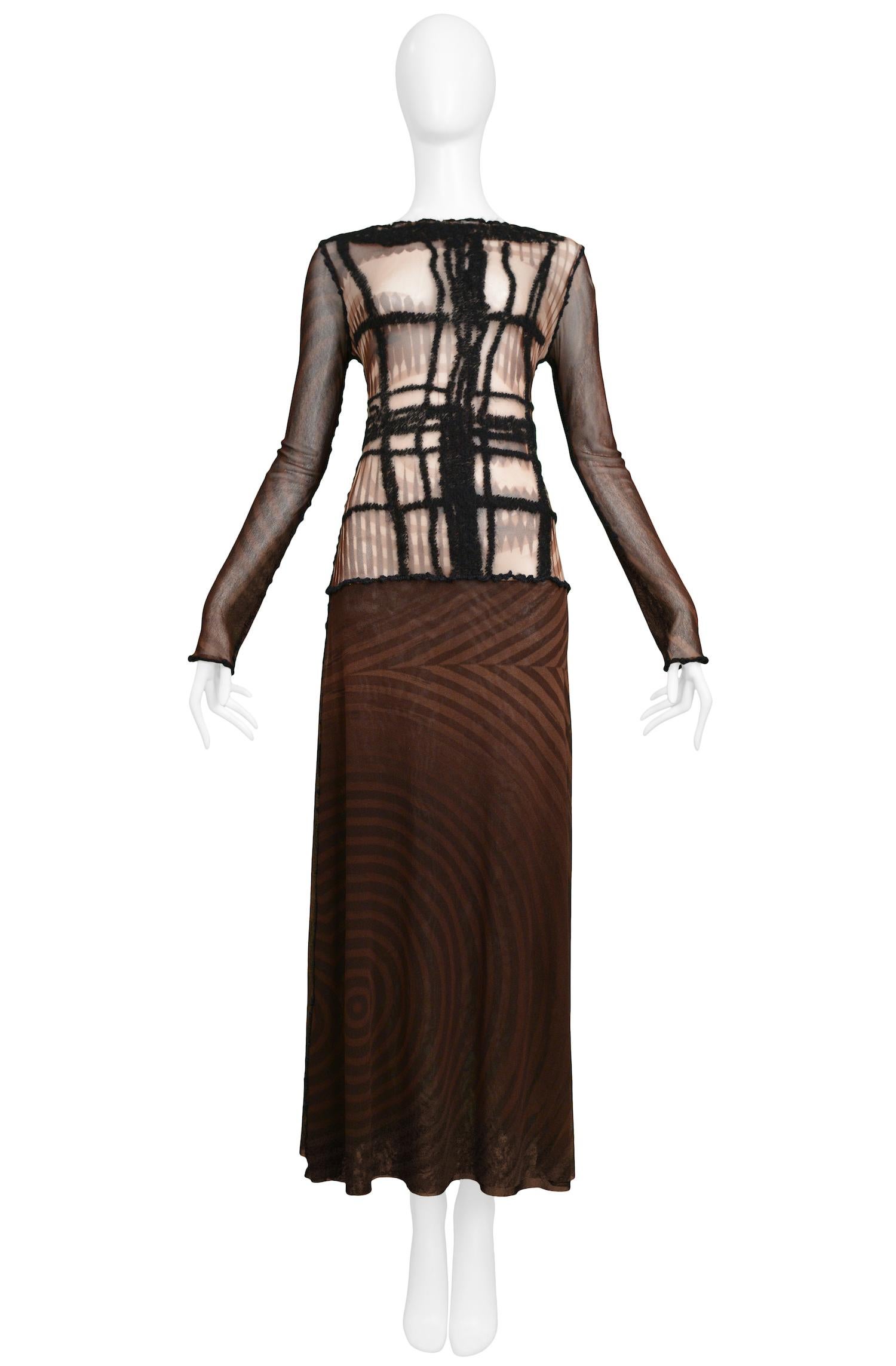 Vintage Jean Paul Gaultier brown long-sleeved mesh dress with a print of a face on the torso, dropped waist, and yarn detailing on front torso.

Excellent Vintage Condition.

Size: Medium

Measurements:
Bust 30