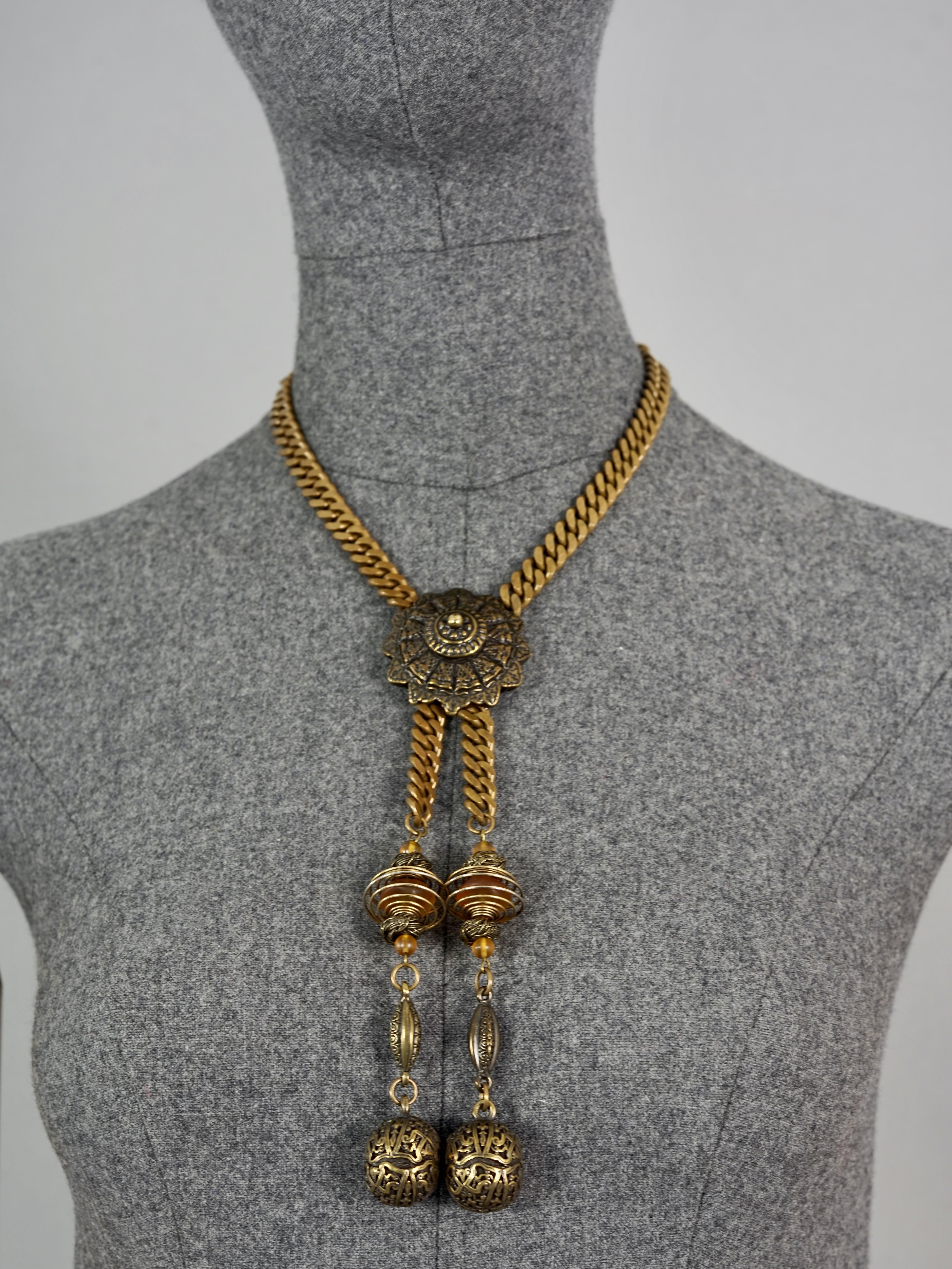 Vintage JEAN PAUL GAULTIER Brutalist Tribal Coil Charm Necklace

Measurements:
Pendant Drop: 7.48 inches (19 cms)
Wearable Length: 16.92 inches (43 cm)

Features:
- 100% Authentic JEAN PAUL GAULTIER.
- Brutalist/ Tribal style necklace.
- Toggle