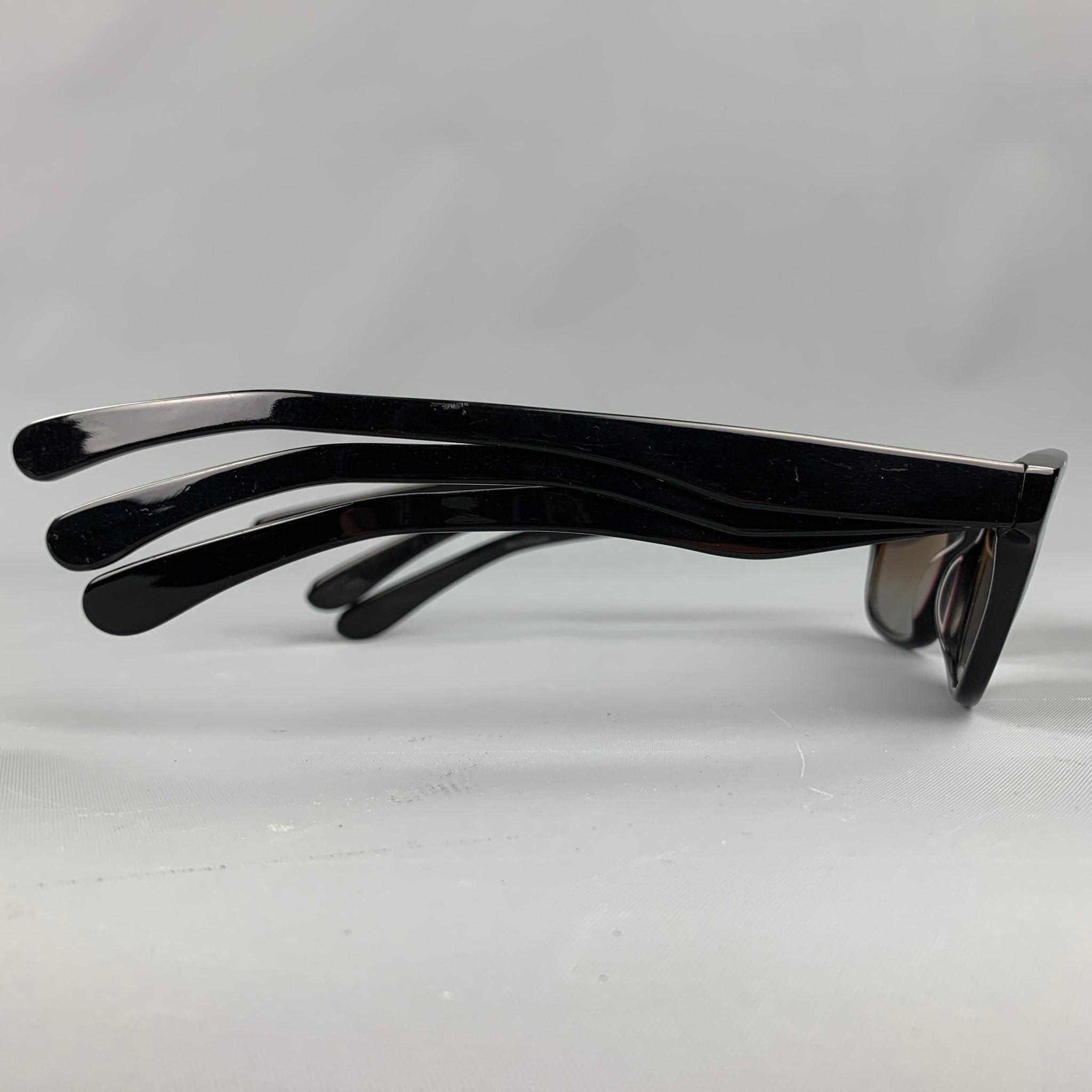 Vintage JEAN PAUL GAULTIER by MIKLI sunglasses comes in a black acetate featuring a three arm style and a oval shape. Made in France. As-Is.

Good Pre-Owned Condition.
Marked: GL1101 0101 4520

Measurements:

Length: 16 cm.
Height: 4 cm. 