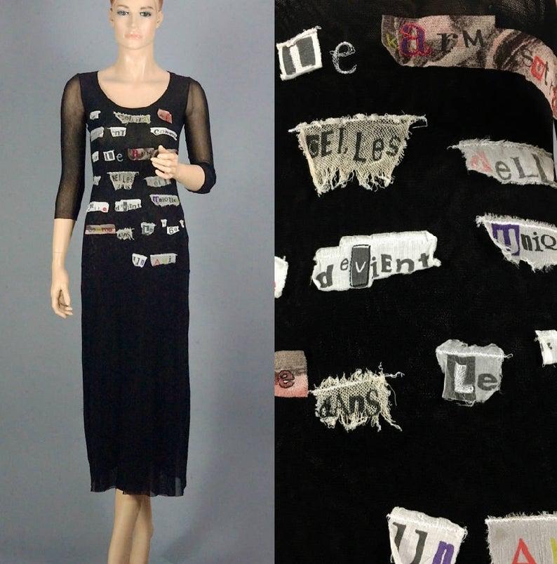 Vintage JEAN PAUL GAULTIER Collage Applique Patches Sheer Mesh Dress

Measurements taken laid flat:
Shoulders: 12.20 inches (31 cm) without stretching
Sleeves: 16.33 inches (41.5 cm)
Bust: 13.77 inches (35 cm) without stretching
Waist: 12.59 inches