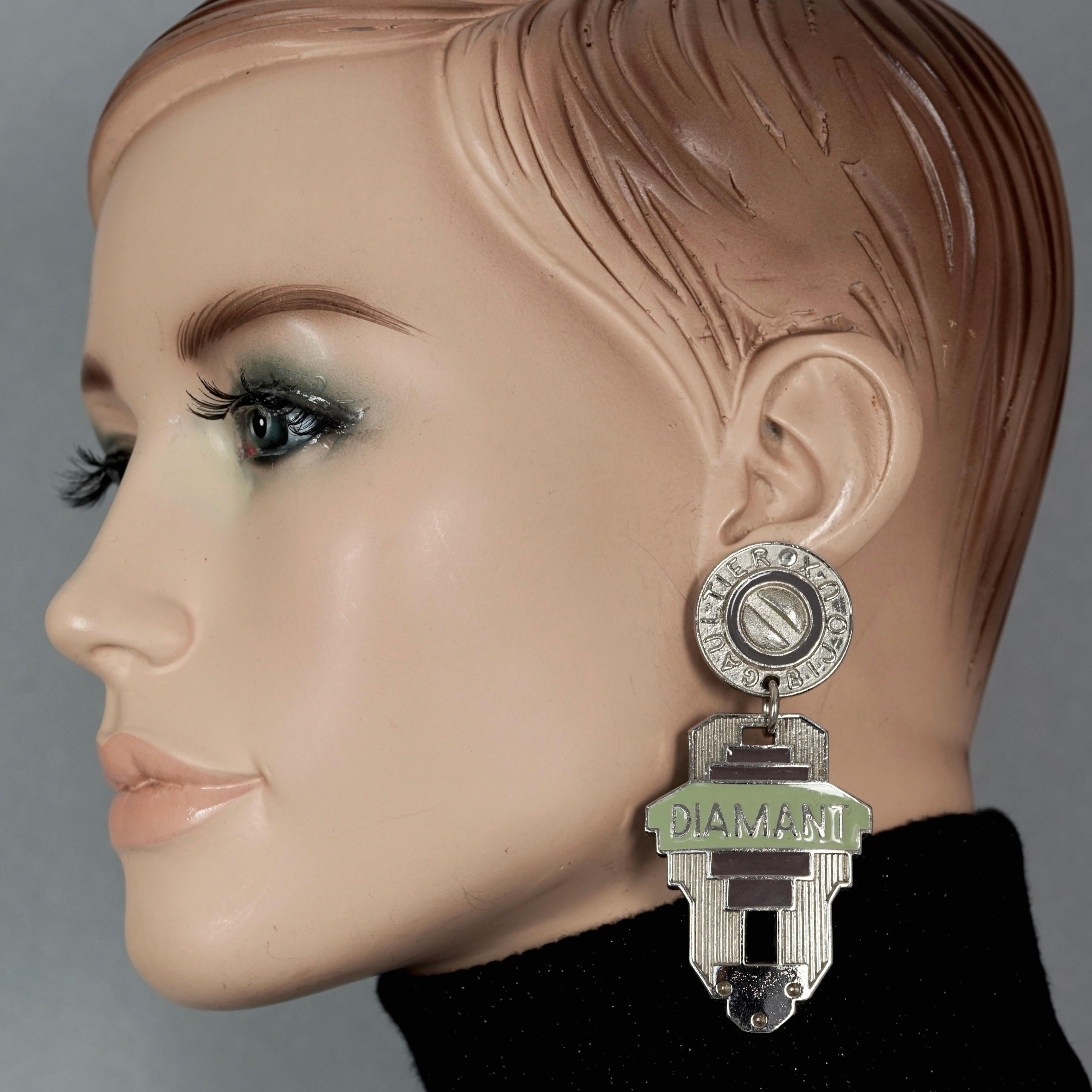 Vintage JEAN PAUL GAULTIER Diamant Bijoux Label Enamel Dangling Earrings

Measurements:
Height: 3.30 inches (8.4 cm)
Width: 1.53 inches (3.9 cm)
Weight per Earring: 30 grams

Features:
- 100% Authentic JEAN PAUL GAULTIER.
- Massive enamel earrings