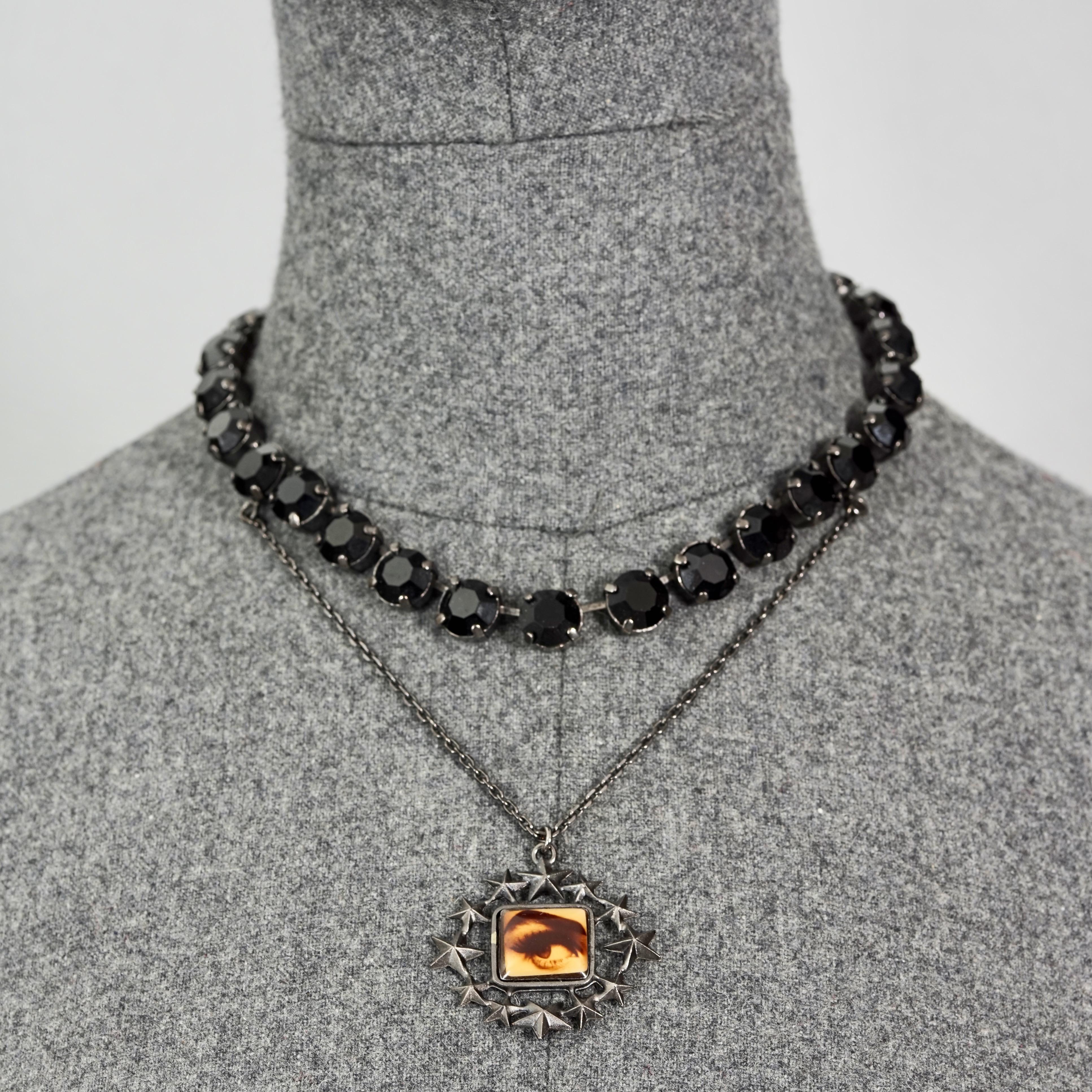 Vintage JEAN PAUL GAULTIER Eye Stars Novelty Black Rhinestones Gothic Necklace

Measurements:
Height Centrepiece: 4.13 inches (10.5 cm)
Wearable Length: 15.35 inches (39 cm)

Features:
- 100% Authentic JEAN PAUL GAULTIER.
- Black rhinestones